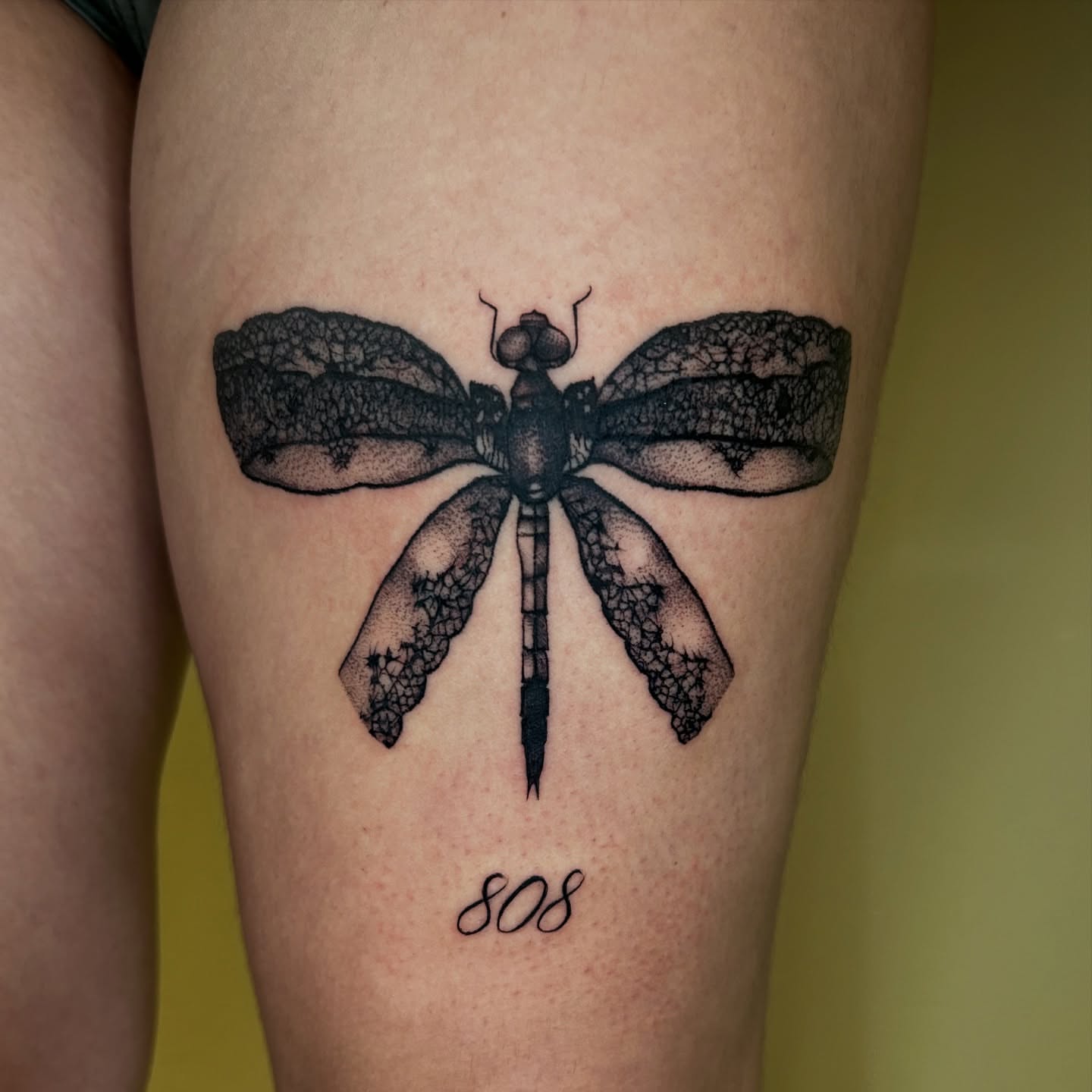 Dragonfly dotwork tattoo on the thigh by Cassy D, Miami, Florida
