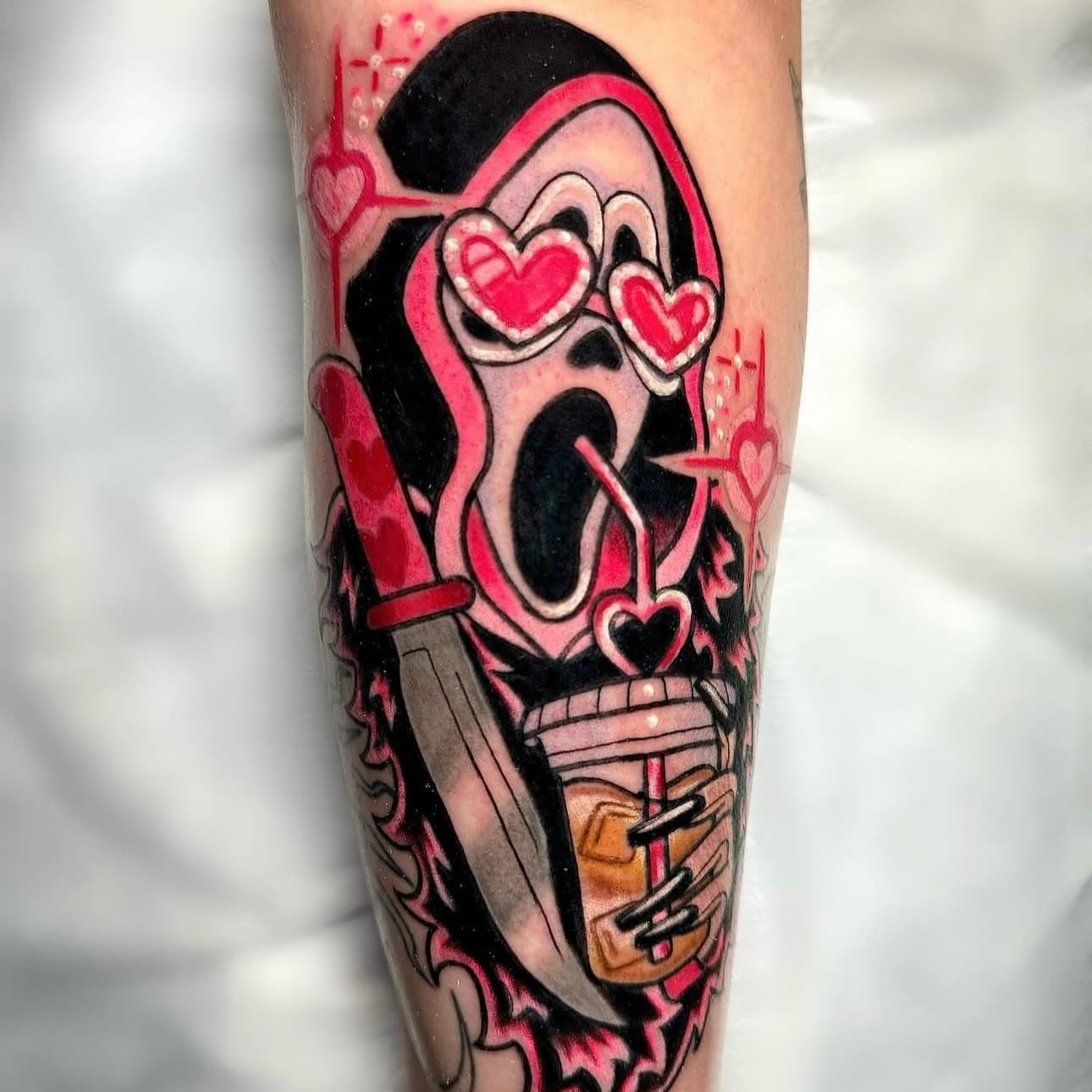 Ghost with hearts American traditional tattoo on the forearm by Bailey Drey