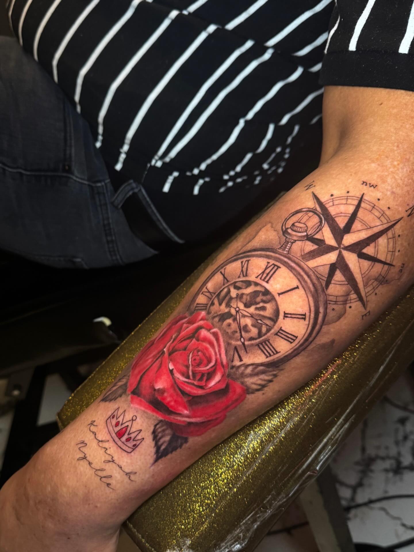 Clock, rose, compass realism tattoo on the forearm by Marquis Neal
