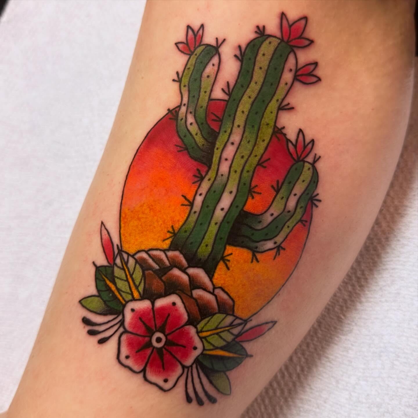 Cactus and flowers American traditional tattoo on the forearm by Shelby