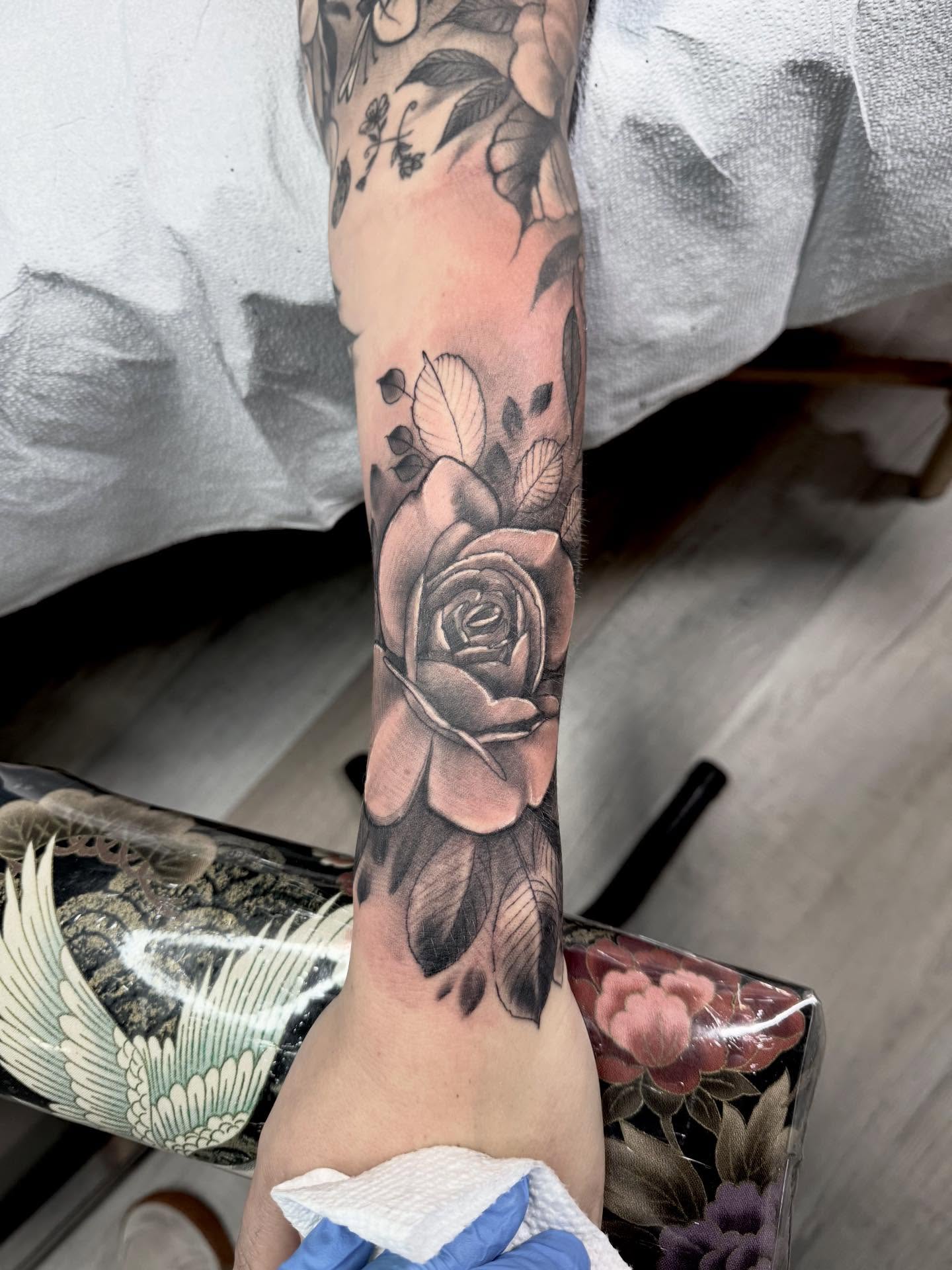 Rose black and grey tattoo on the forearm by jonhighland