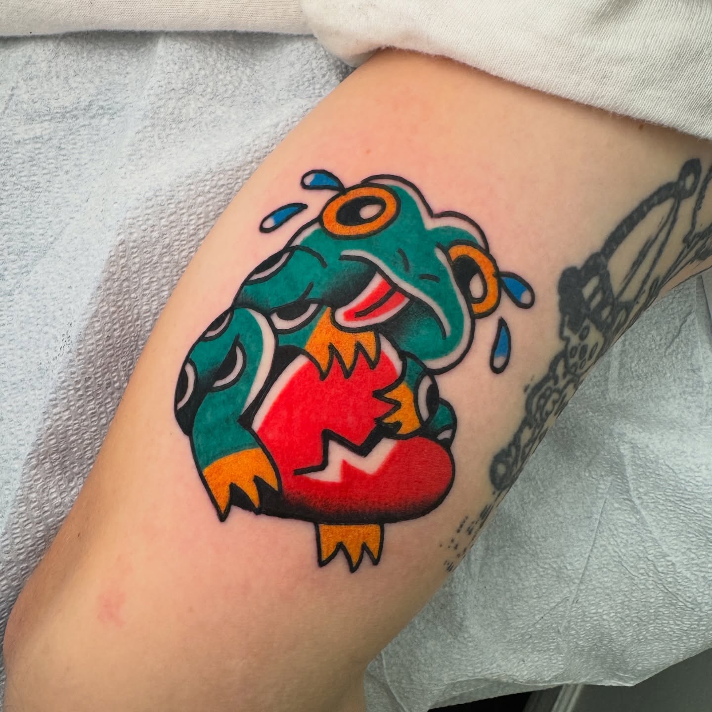 Frog American traditional tattoo on the forearm by Rafael Torres, San Francisco, California