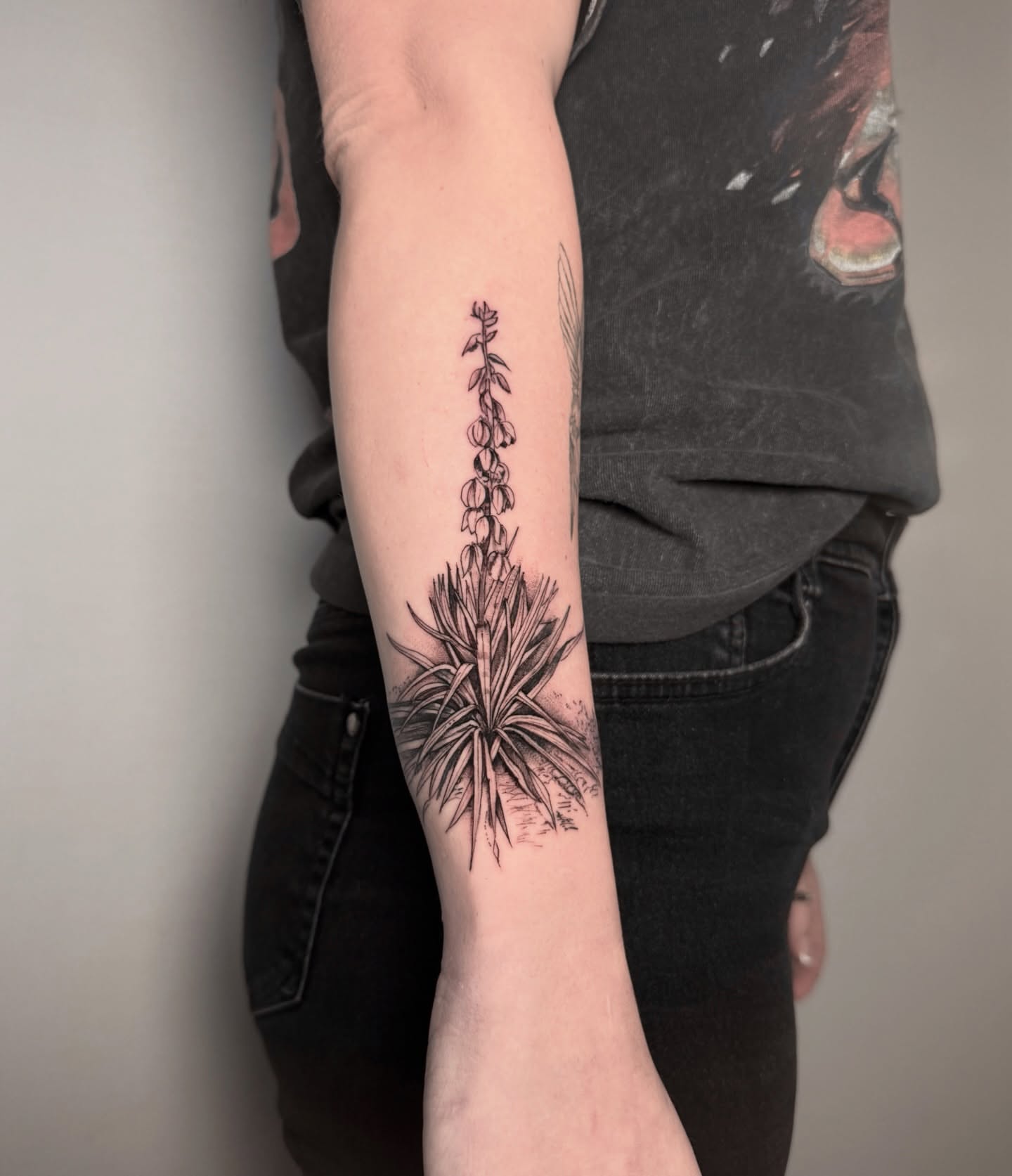 Foxglove plant black and grey tattoo on the forearm by Alex Cantor