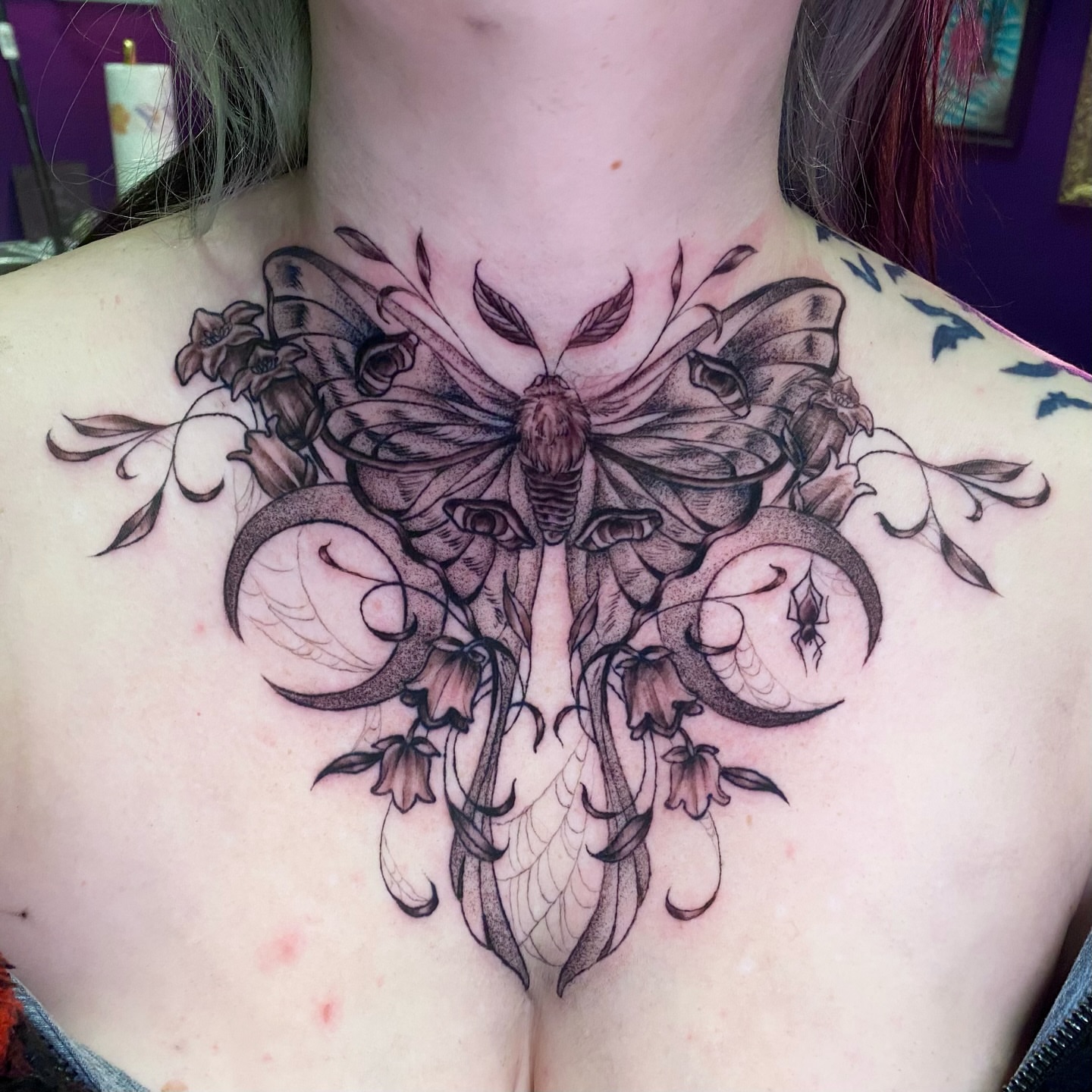 Moth and flowers realism tattoo on the chest by Brittany Whitaker