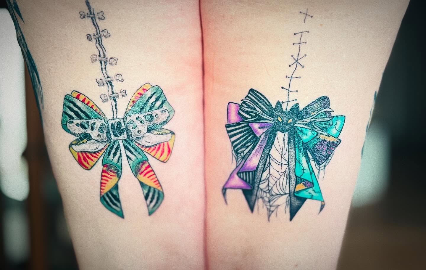 Bow new school tattoo on the thigh by Tasha