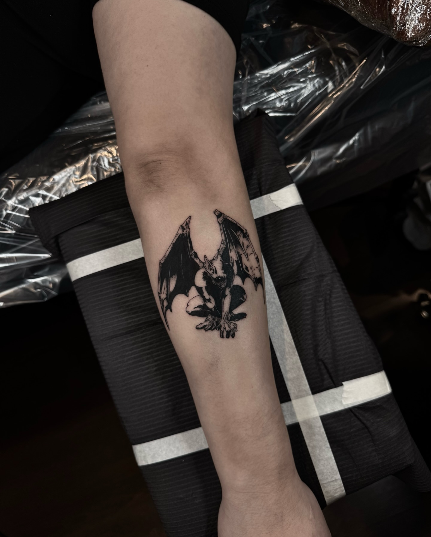 Bat black and grey tattoo on the forearm by Blackwork Vamos