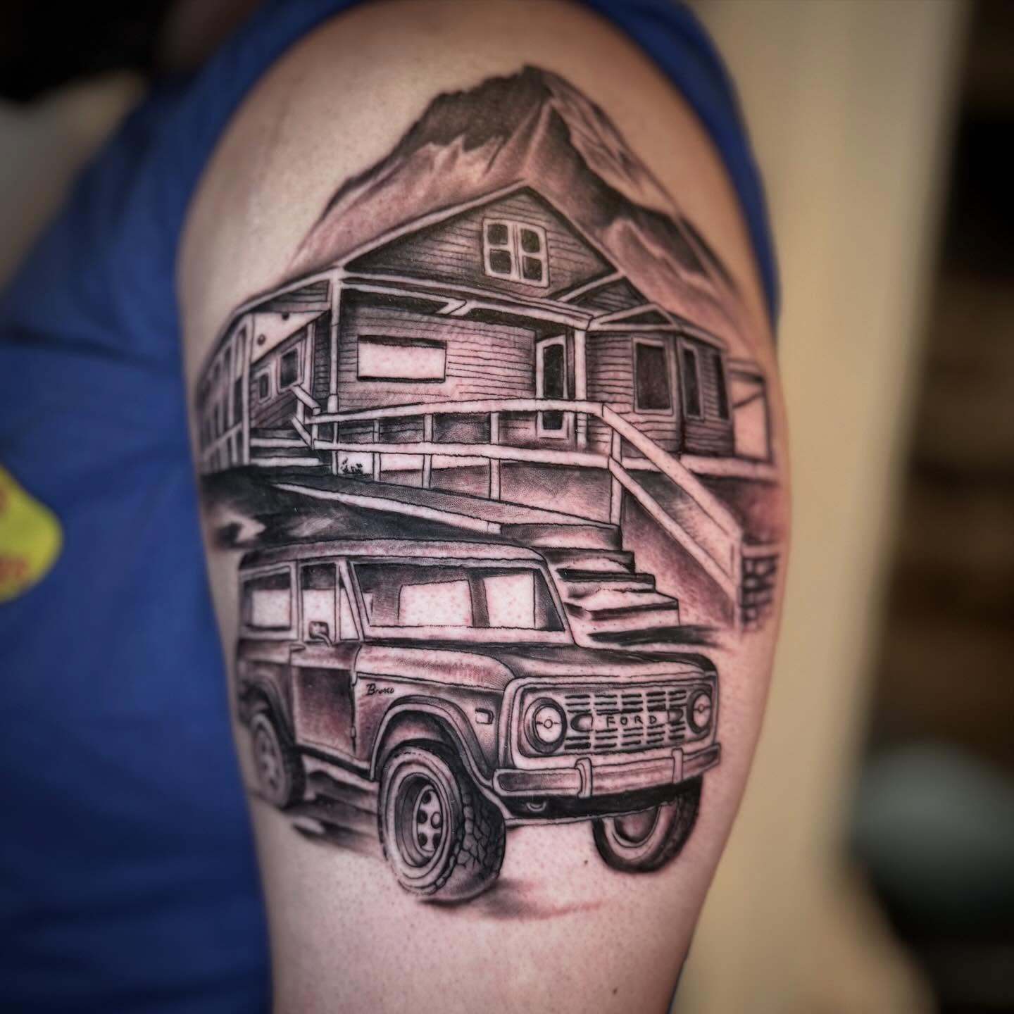 Truck and house realism tattoo on the forearm by Matthew Crawley