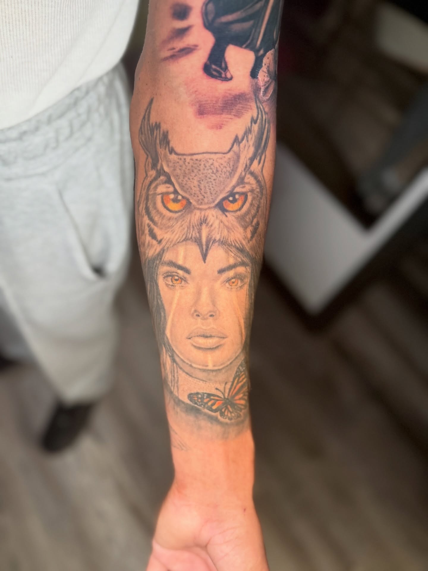 Owl and woman realism tattoo on the forearm by Atlanta Tattoo Artist
