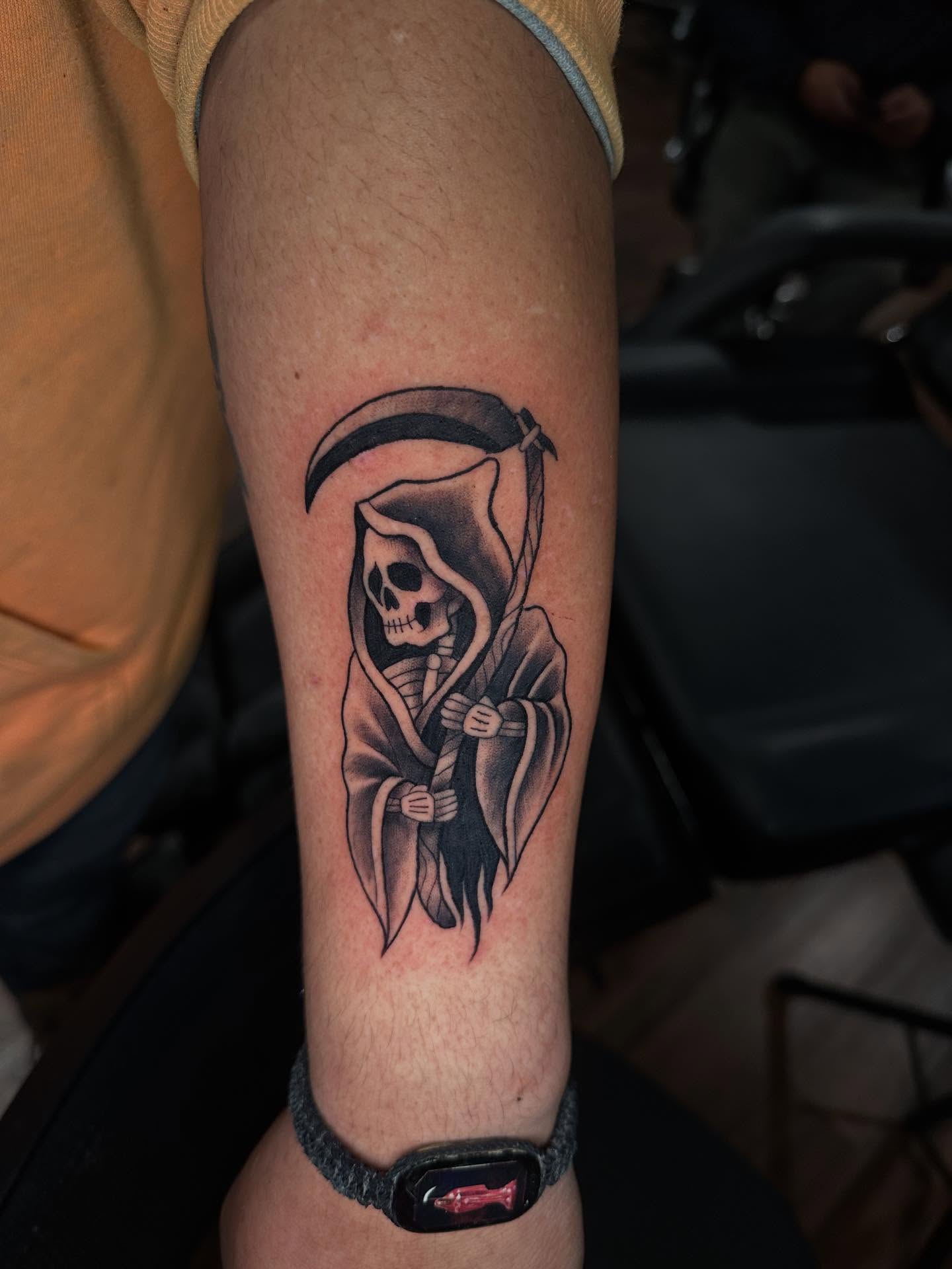 Reaper black and grey tattoo on the forearm by Mario Flores Tattoo