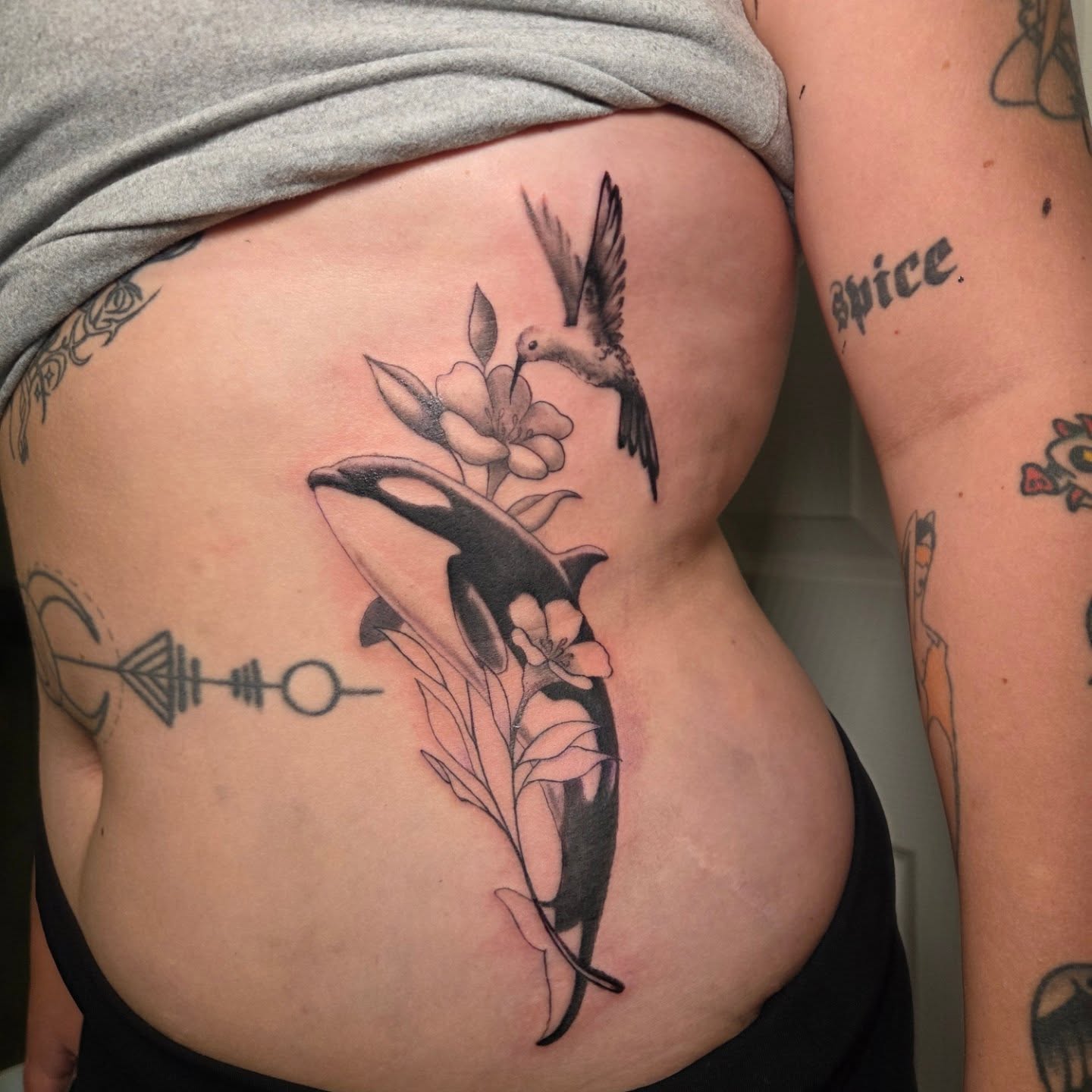 Killer whale and hummingbird realism tattoo on the ribs by Jou Smile (Jo)