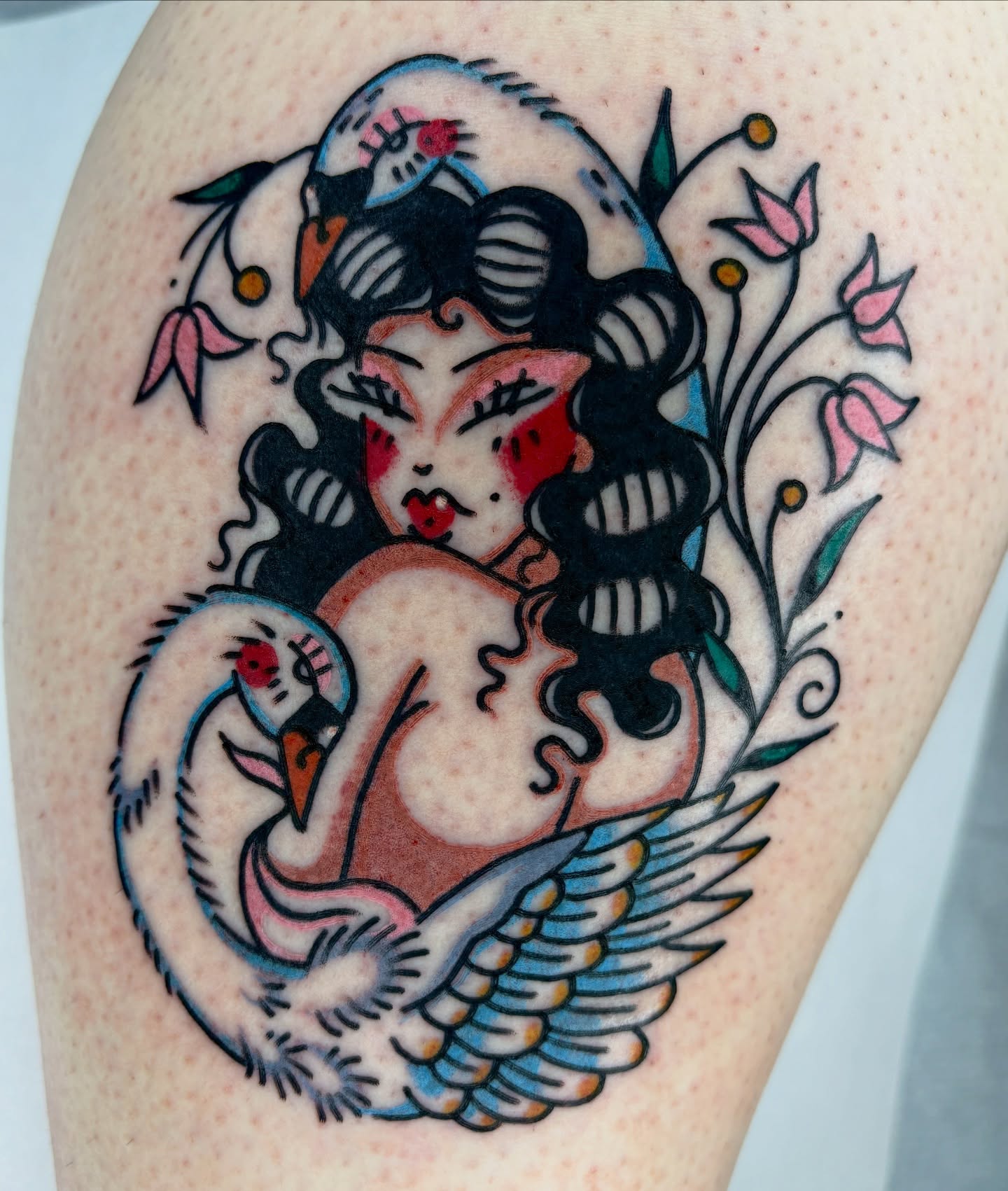 Swan and woman American traditional tattoo on the thigh by Bella