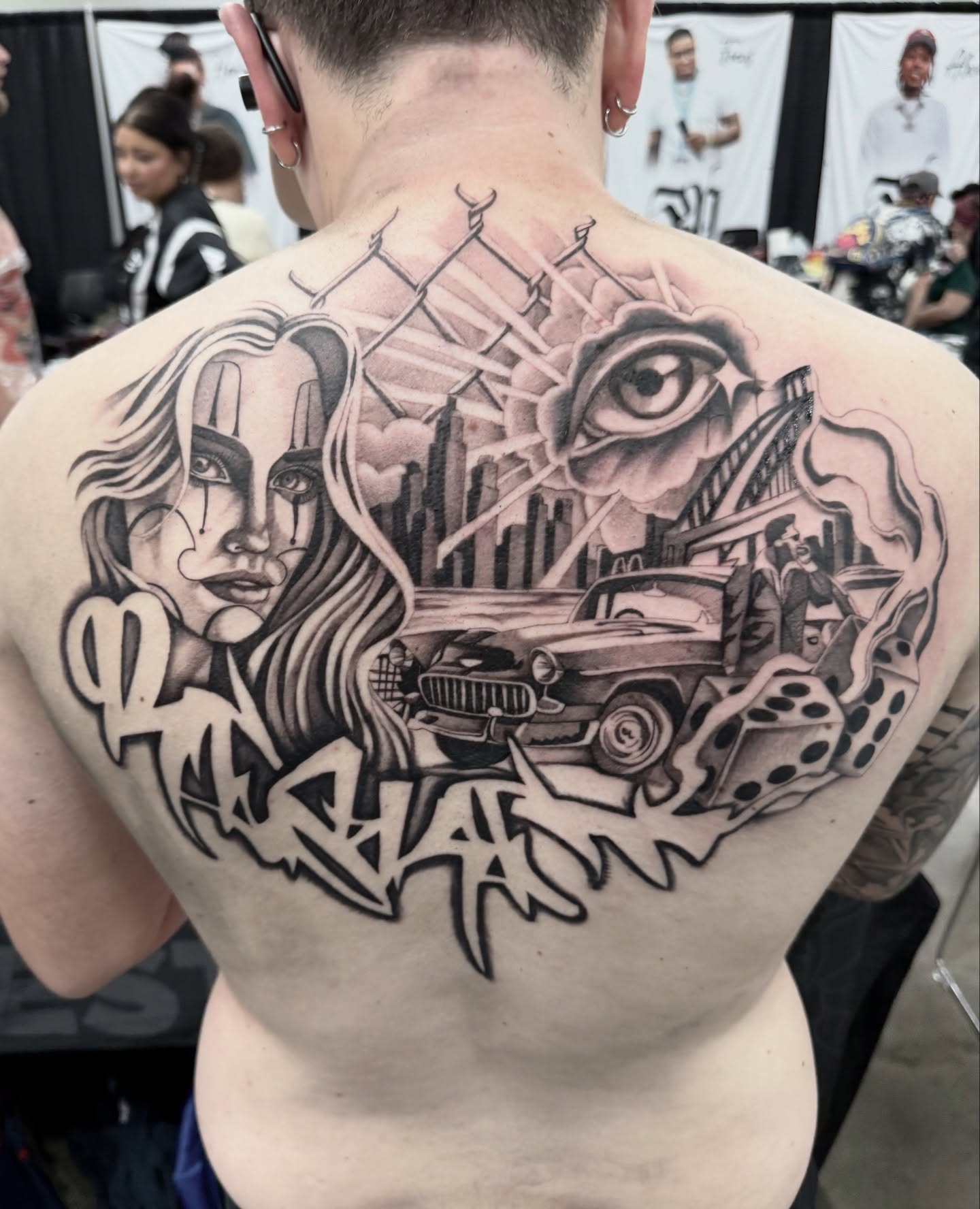 Cityscape with woman and car realism tattoo on the back by Joe Weber, Monona, Wisconsin