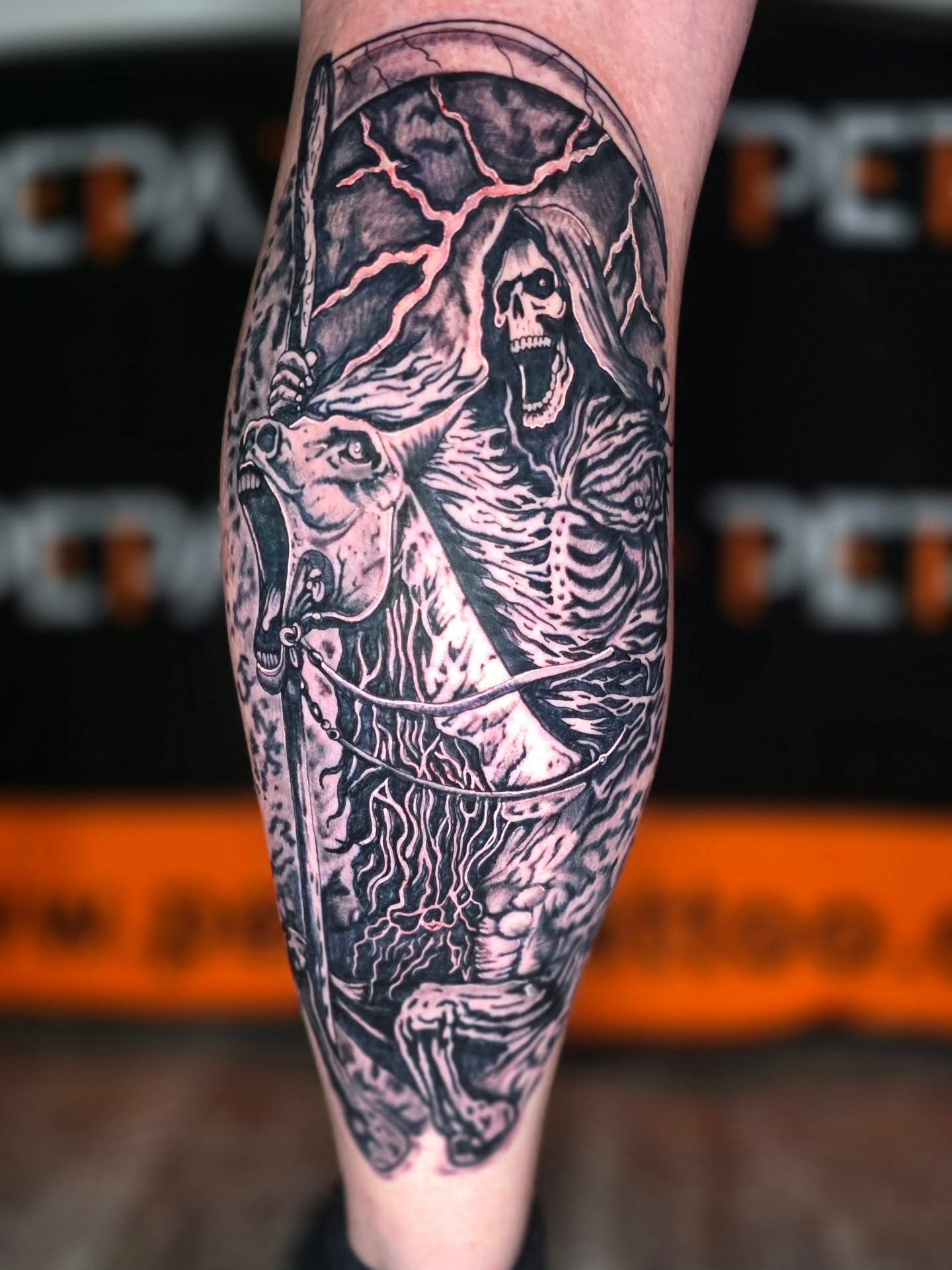 Reaper on horse realism tattoo on the calf by Dylan Fowler