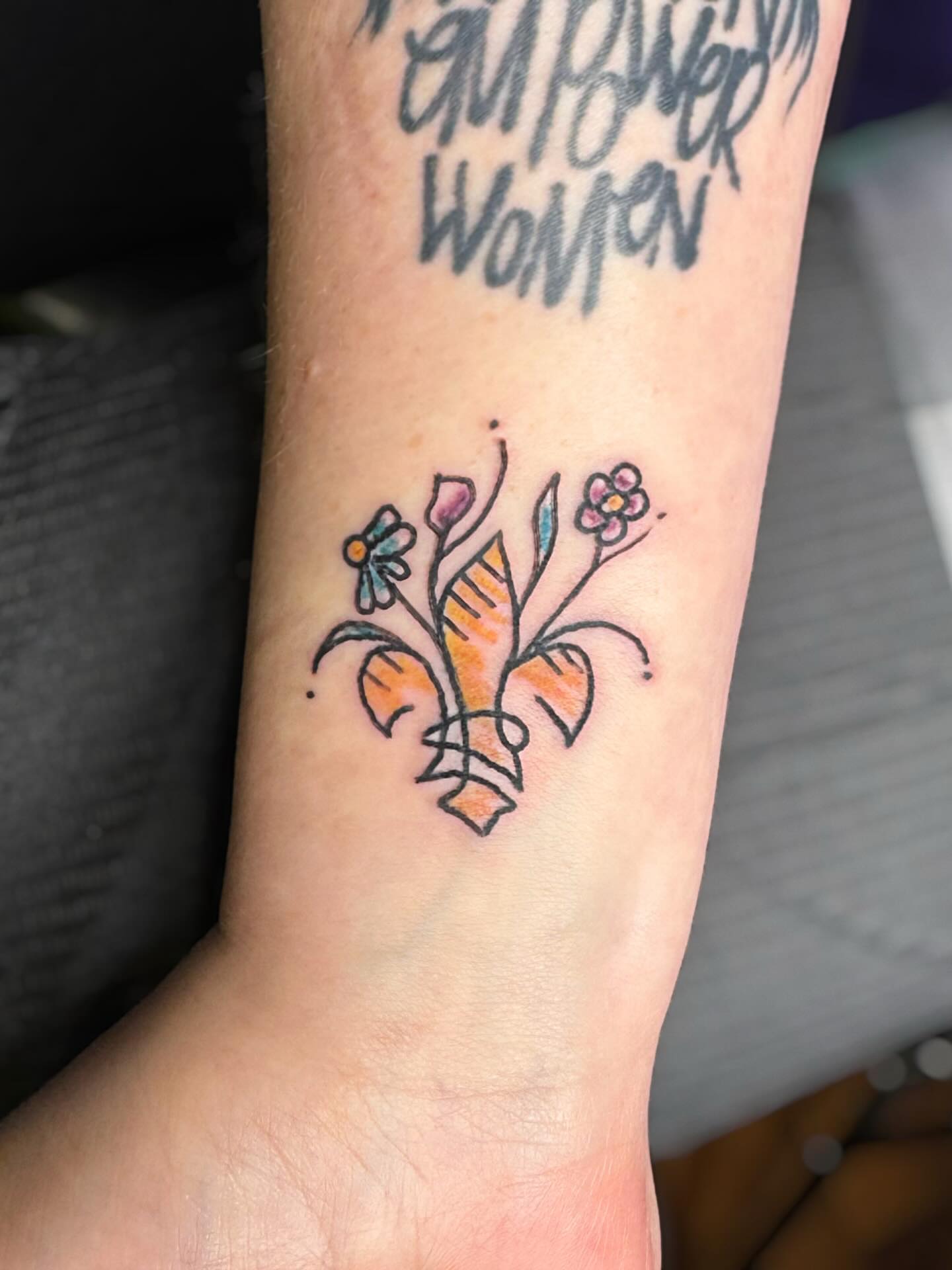 Floral arrangement new school tattoo on the forearm by @brocks_tatt_attic_, New Orleans, Louisiana