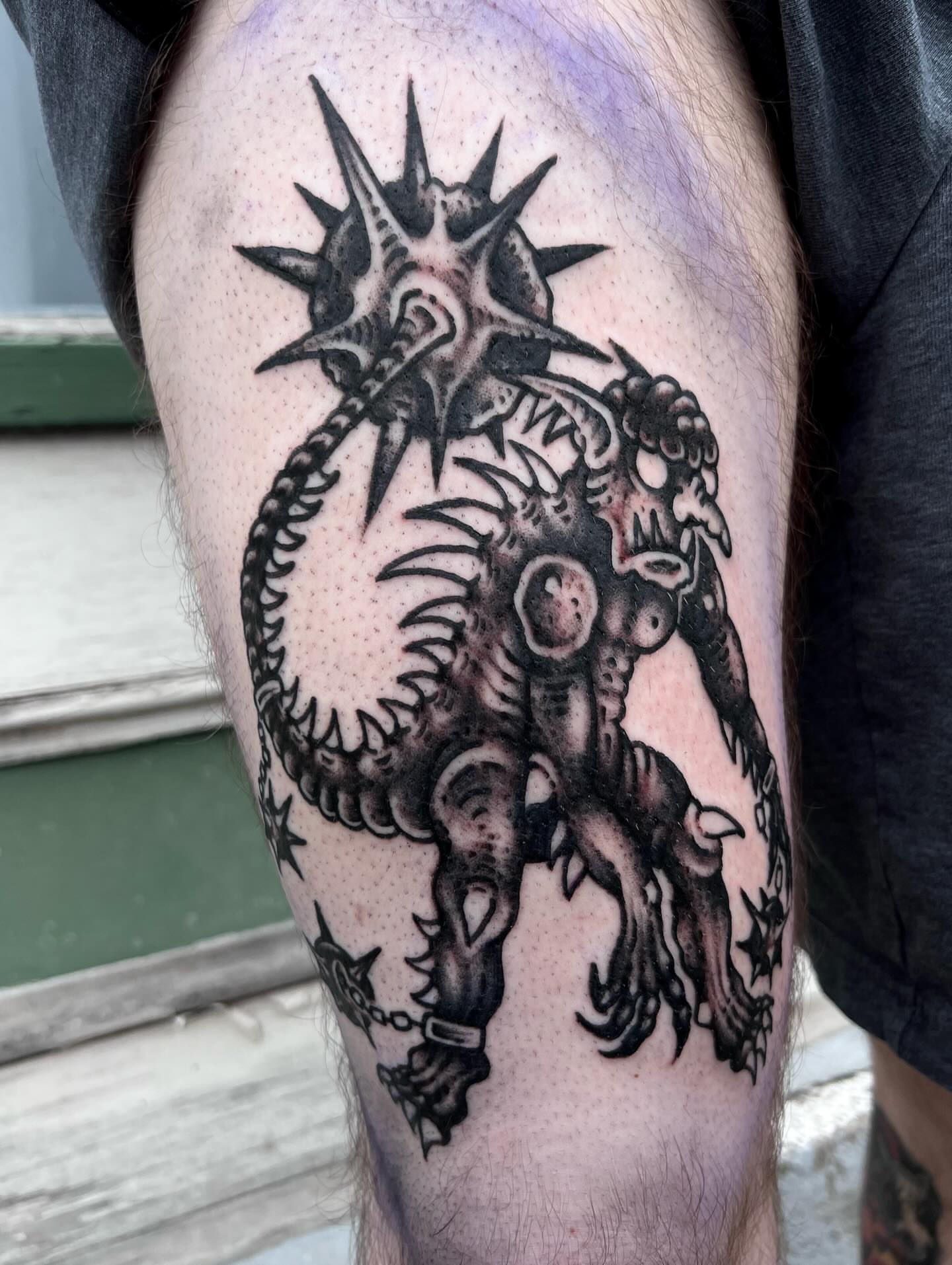 Monster black and grey tattoo on the thigh by Ady Paige