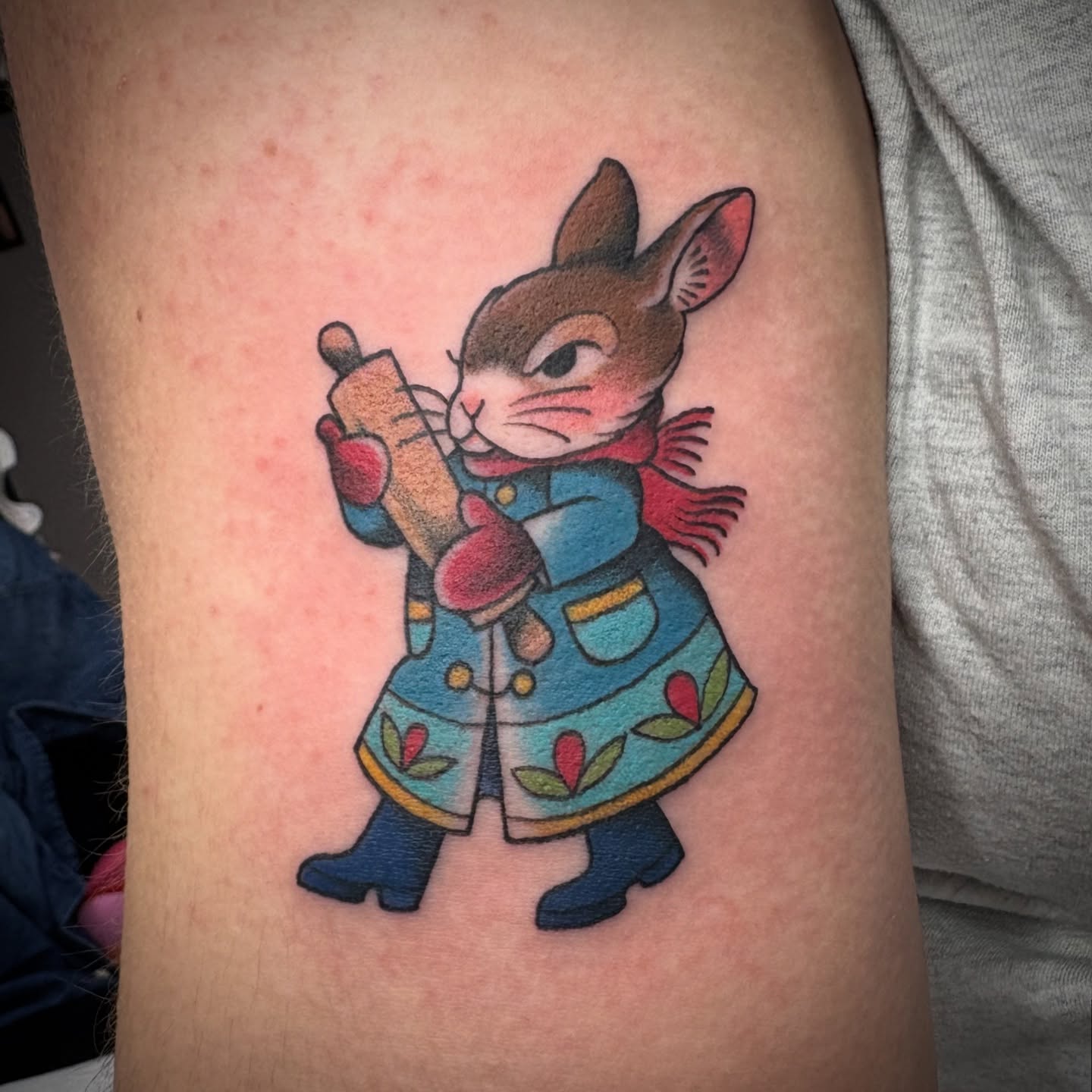 Rabbit with book American traditional tattoo on the forearm by Lu Taylor, Minneapolis, Minnesota