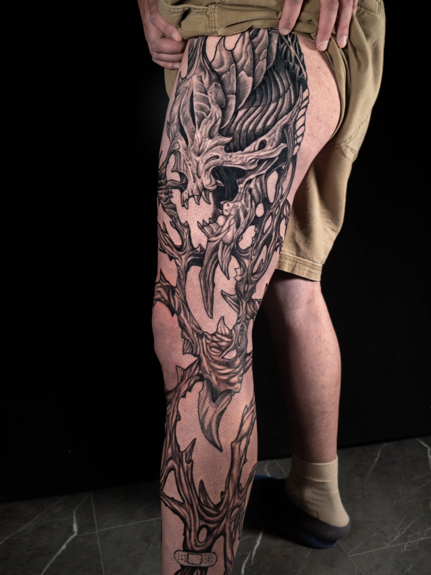 Demon skull dark realism tattoo on the thigh by EyeSee Tattoos