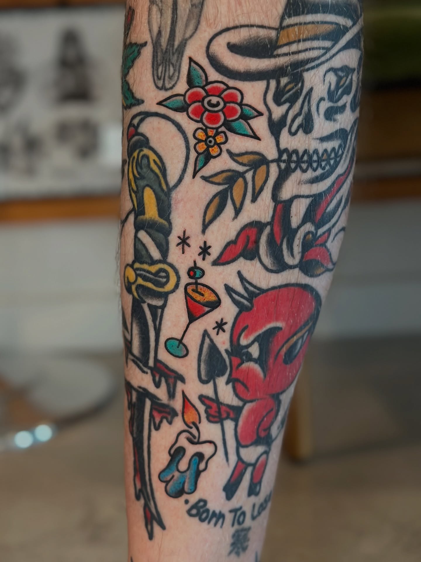 Skull and devil American traditional tattoo on the forearm by Michael Williams