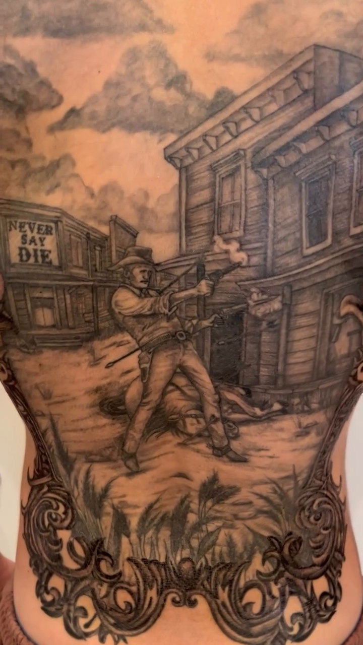 Wild West shootout scene Chicano tattoo on the back by DL Tats, Cape Girardeau, Missouri