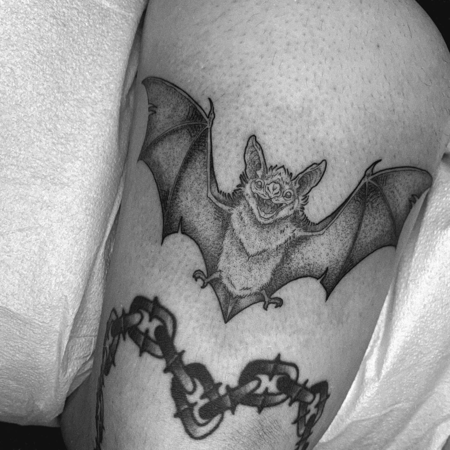 Bat dotwork tattoo on the thigh by Kitty Jones, Berkeley, California