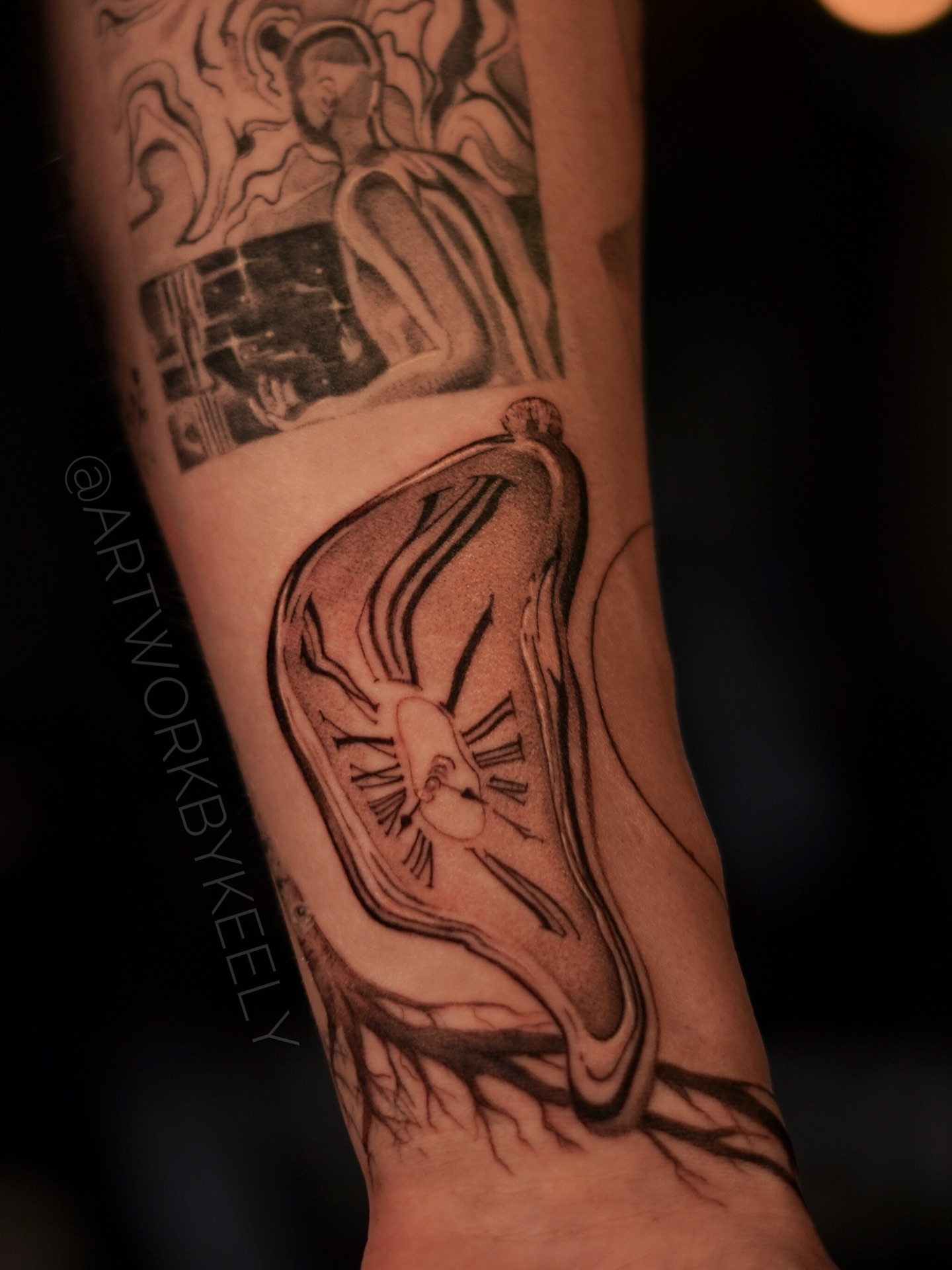 Melting face surrealism tattoo on the forearm by Keely Thompson