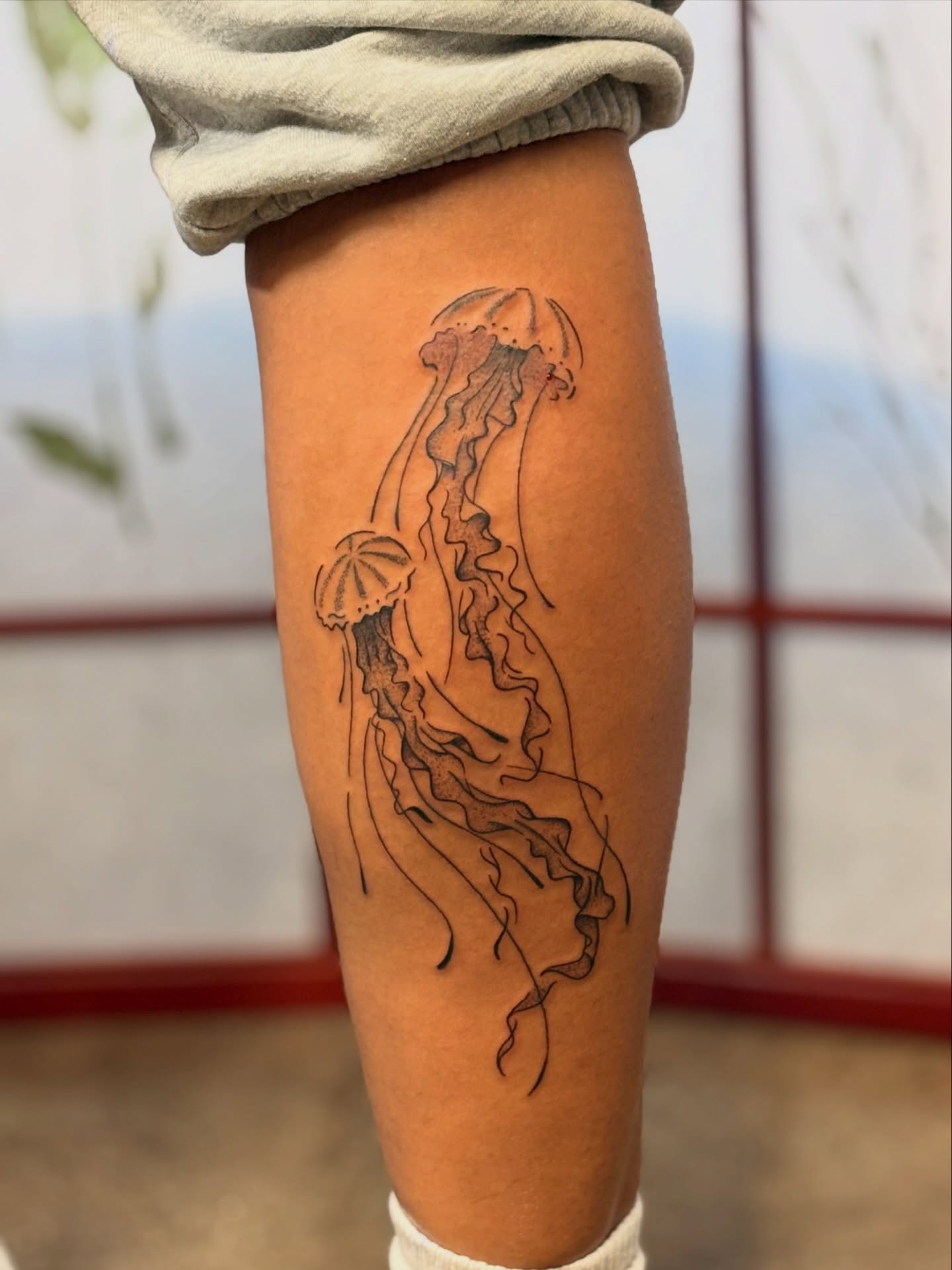 Jellyfish black and grey tattoo on the forearm by CJ