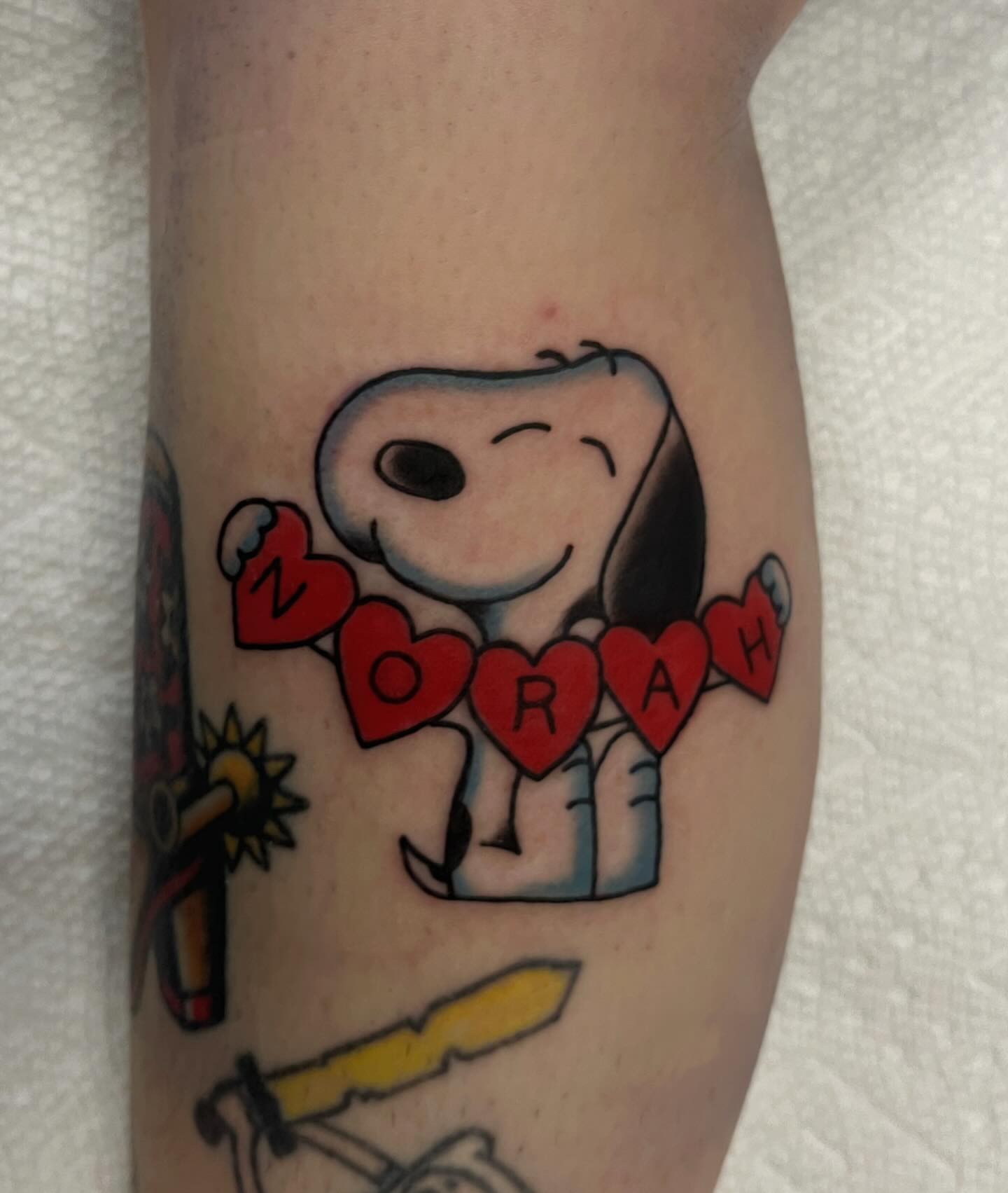 Snoopy American traditional tattoo on the forearm by Elizabeth Summers ❨・¨⬮ Traditional Tattoo