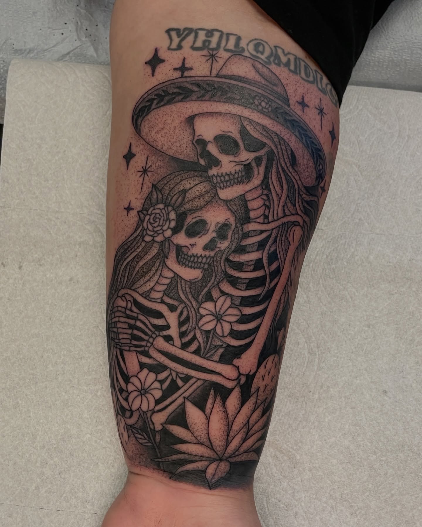 Skeleton couple realism tattoo on the calf by Austin Clark
