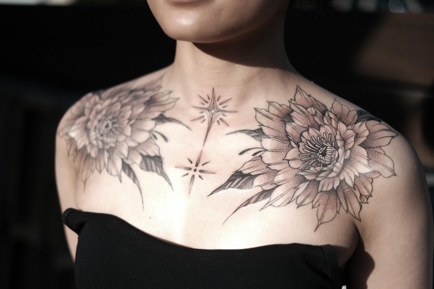 Sunflowers and stars realism tattoo on the chest by Isabelle Kellar, San Diego, California