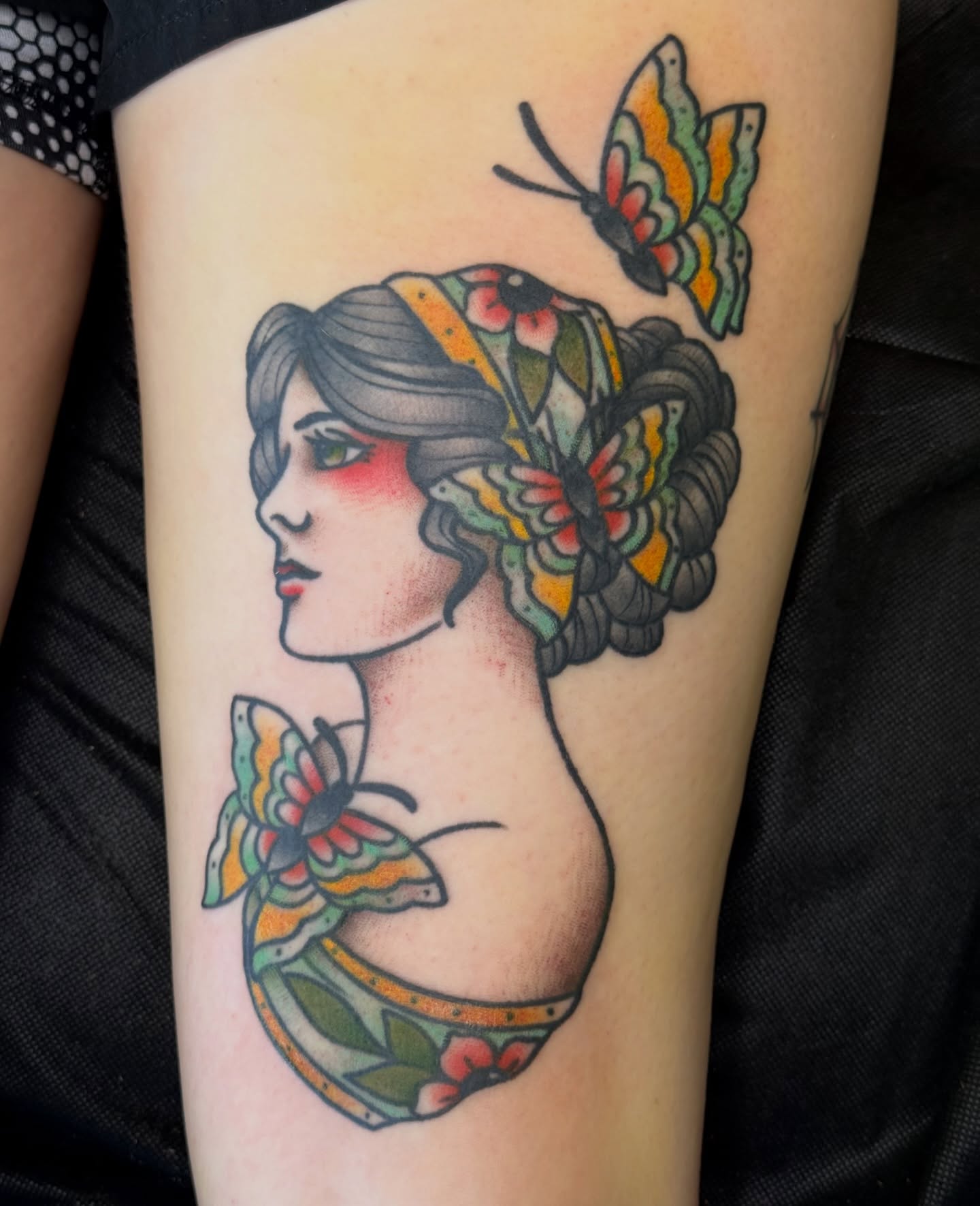Woman with butterflies American traditional tattoo on the forearm by Kelsey Louis, Iowa City, Iowa
