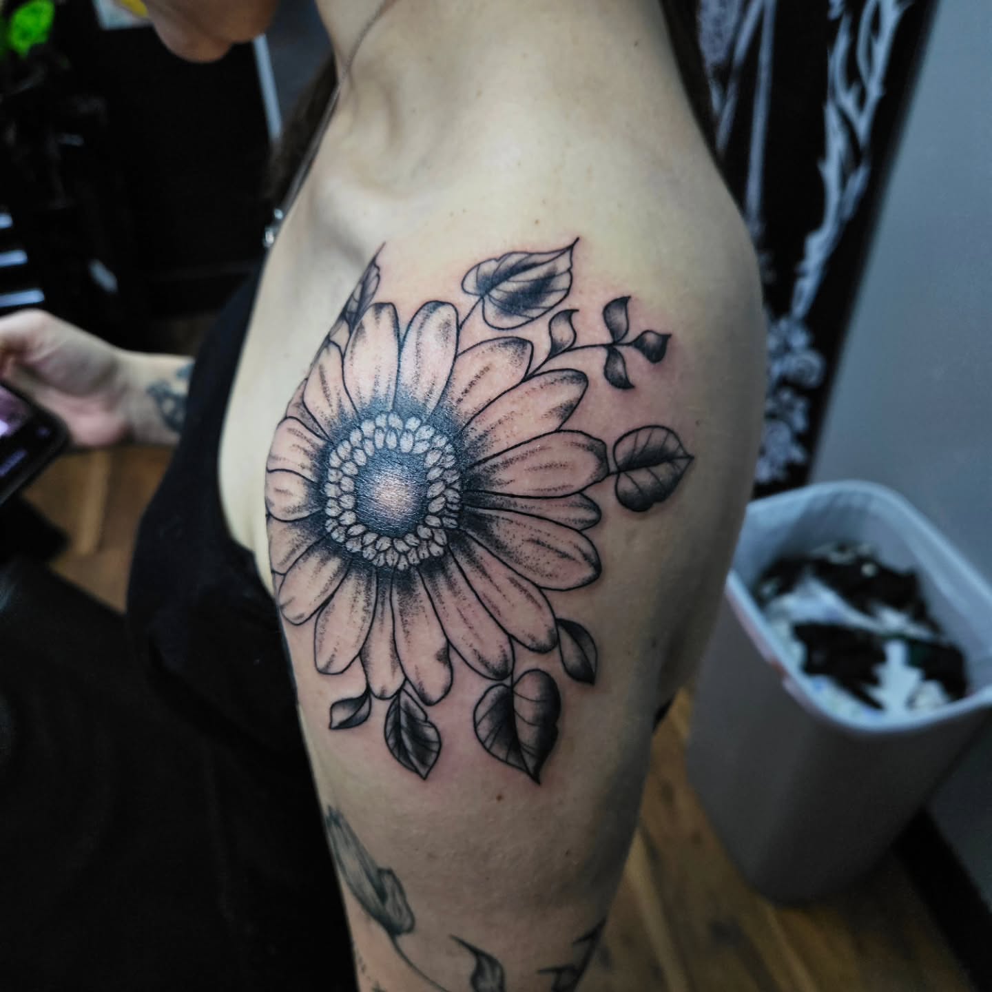 Sunflower dotwork tattoo on the thigh by Danny