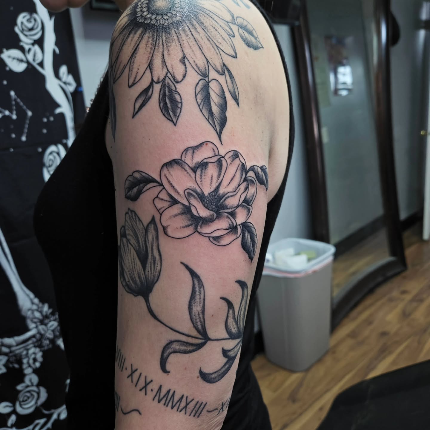 Flower black and grey tattoo on the forearm by Danny