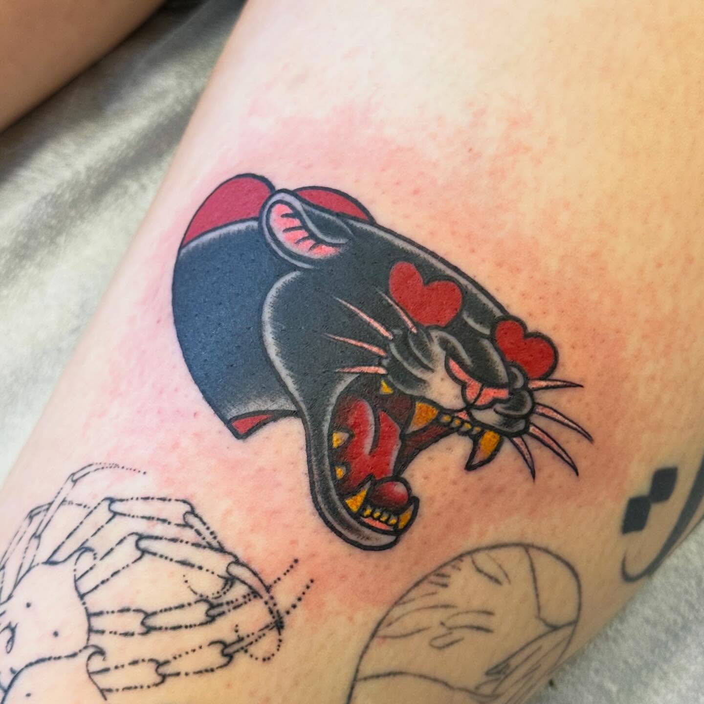 Panther American traditional tattoo on the forearm by Katie Beth