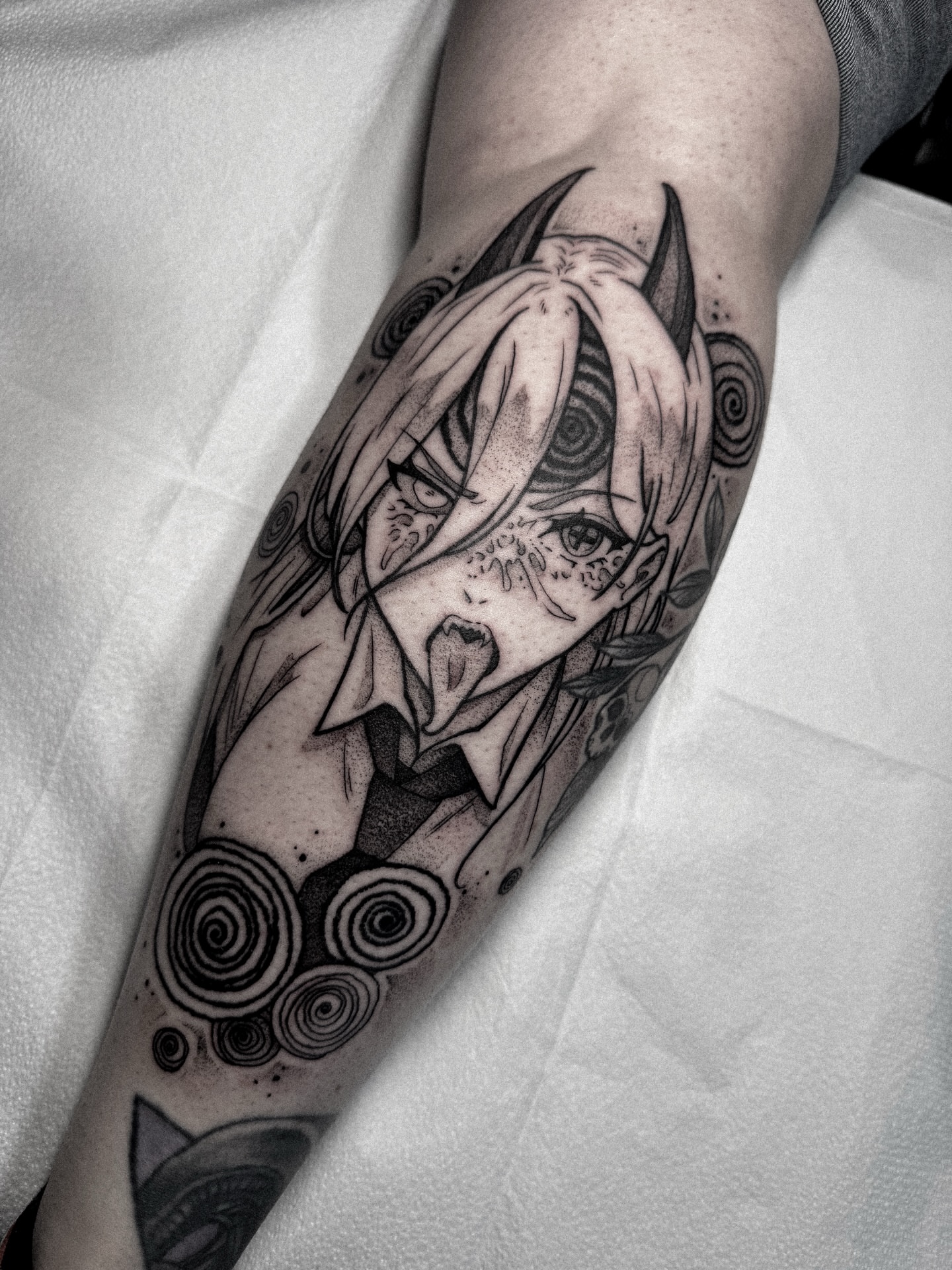 Anime character anime tattoo on the forearm by Dane Bezeau