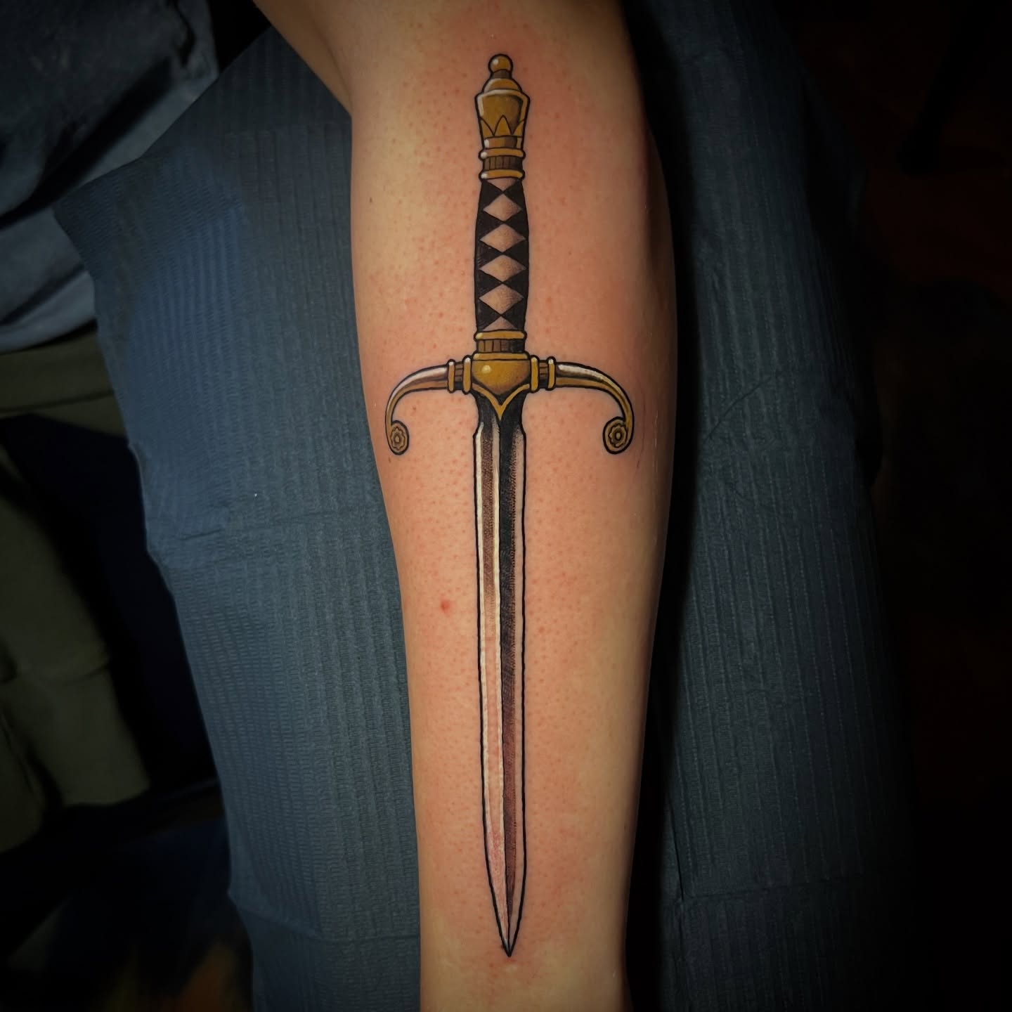 Sword American traditional tattoo on the forearm by Michael Munter, Philadelphia, Pennsylvania