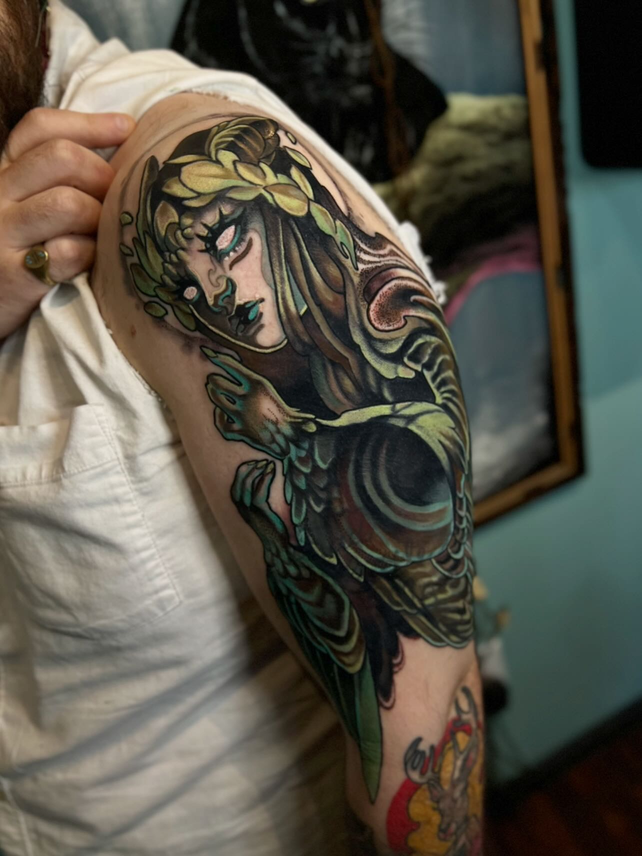 Woman with snake American traditional tattoo on the shoulder by Jen Love