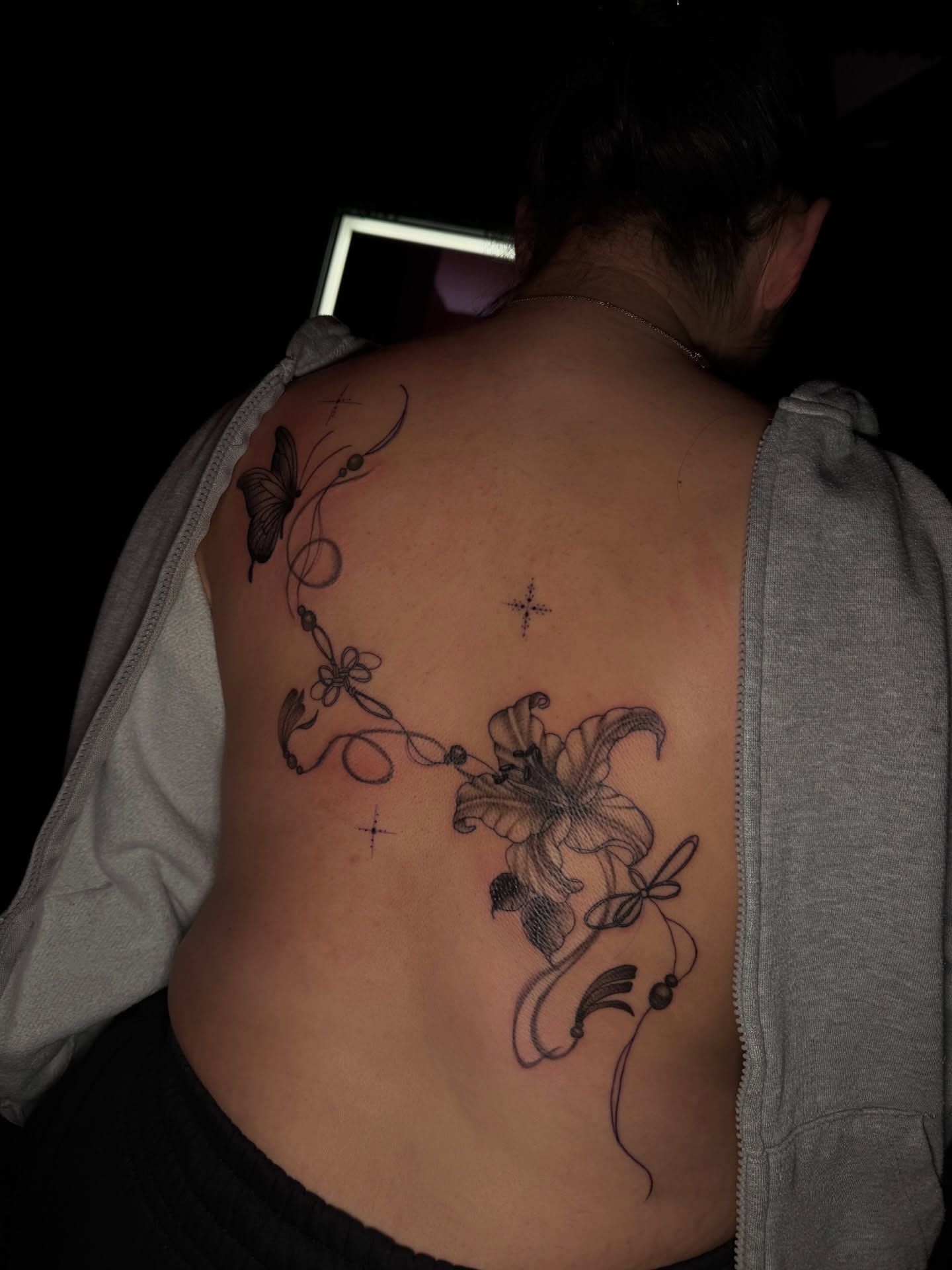 Lily and butterfly black and grey tattoo on the back by Austin Tattoo Artist💉
