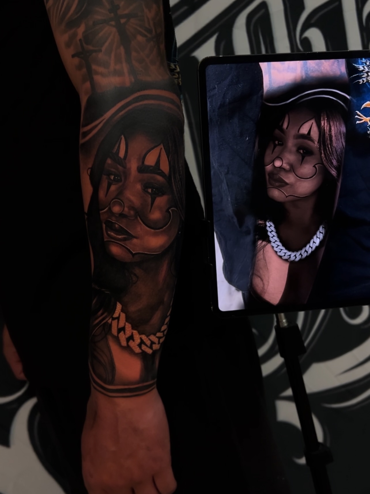 Woman with hood realism tattoo on the forearm by Daniel Michael Perez