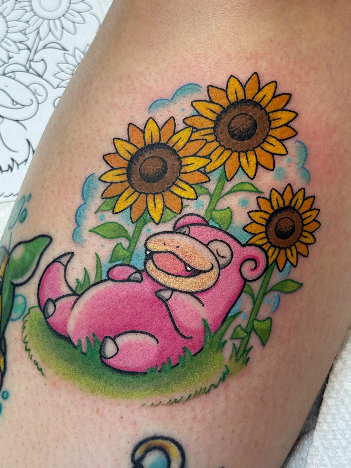 Sunflower and charmander new school tattoo on the thigh by vic
