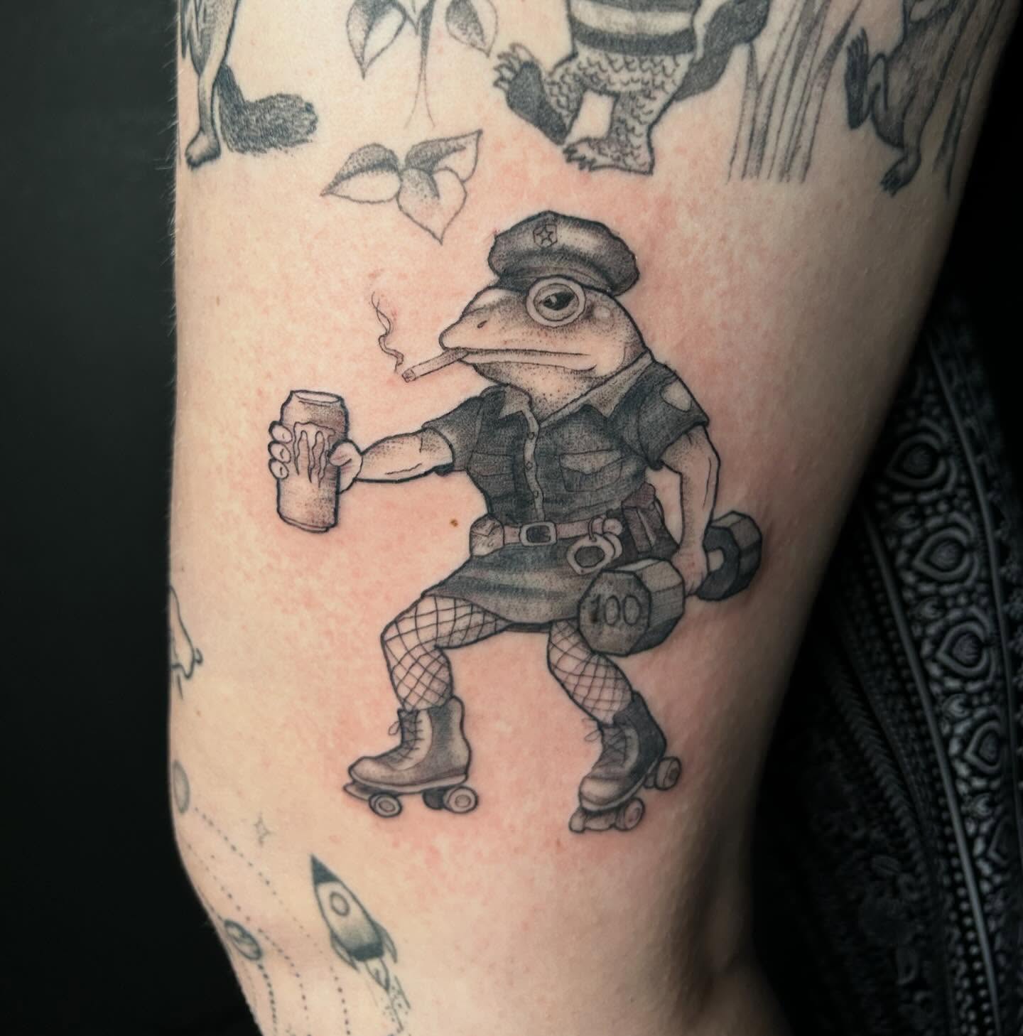 Frog police officer black and grey tattoo on the forearm by Elizabeth (Lib), Murfreesboro, Tennessee