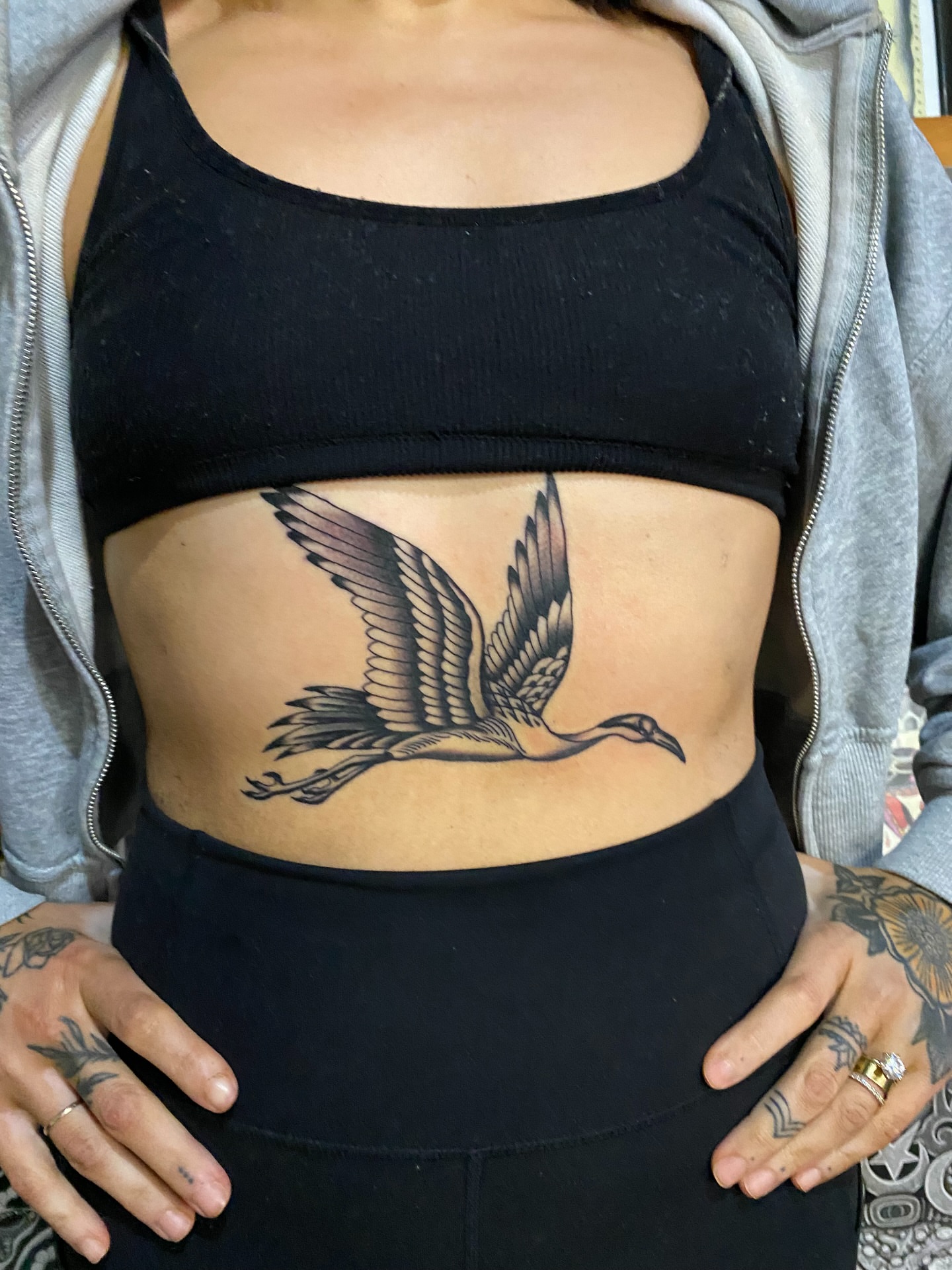 Bird black and grey tattoo on the torso by sean drennen