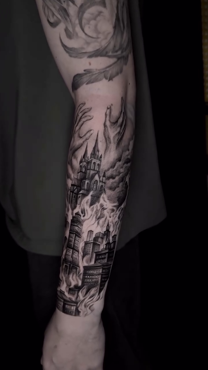 Burning castle with clouds dark realism tattoo by Kris Tattoo Chicago