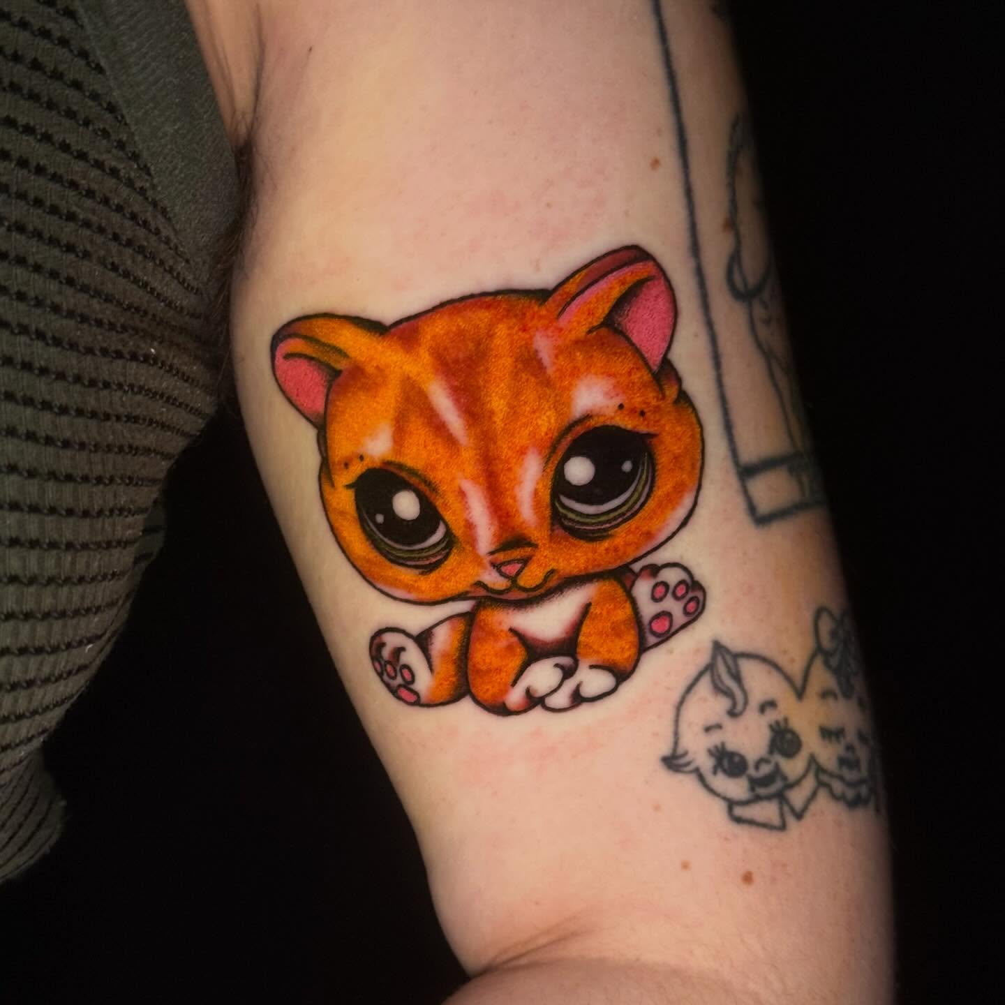 Cat dotwork tattoo on the forearm by Mallory Brown