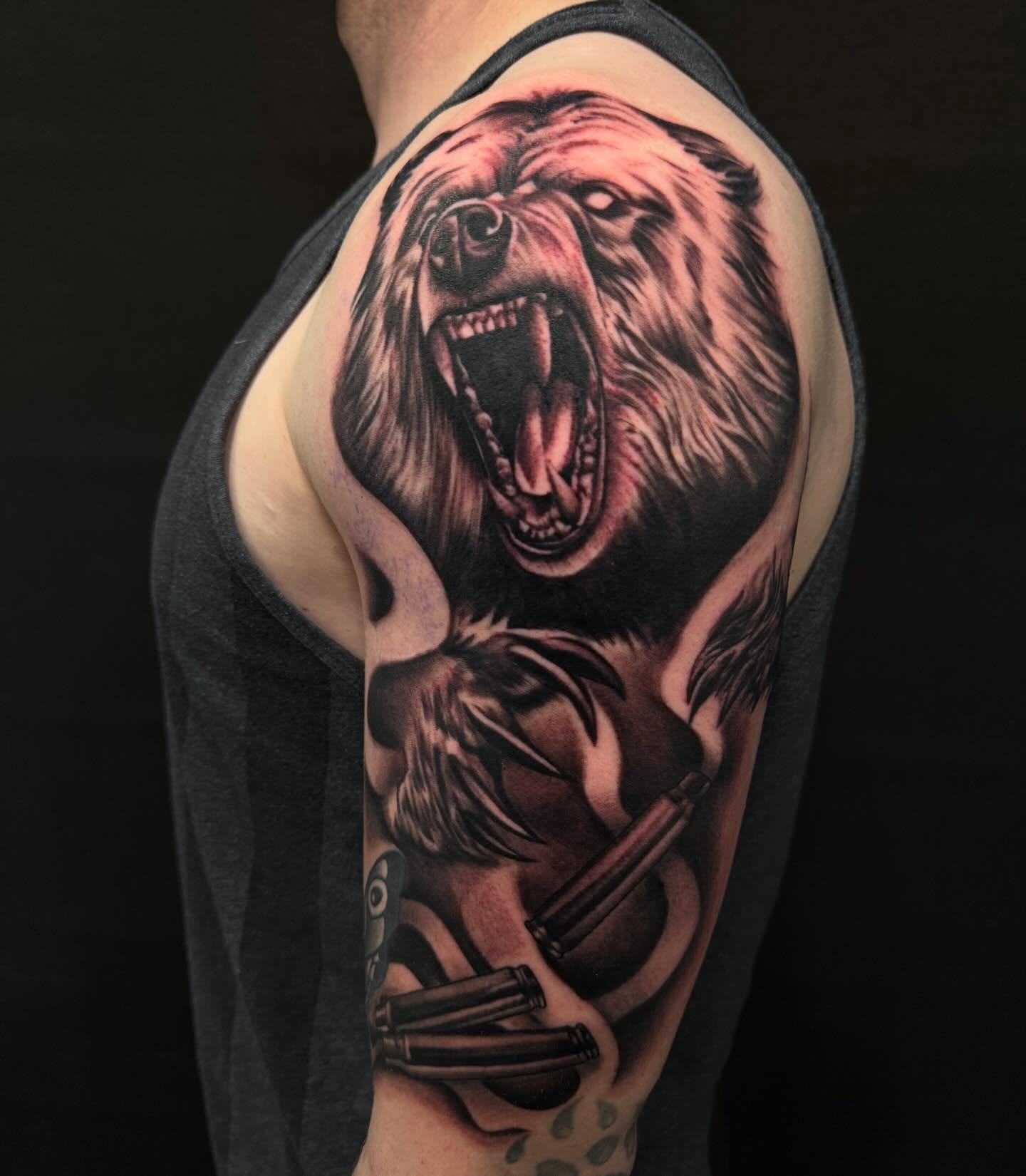 Roaring bear realism tattoo on the shoulder by Brian Herrera