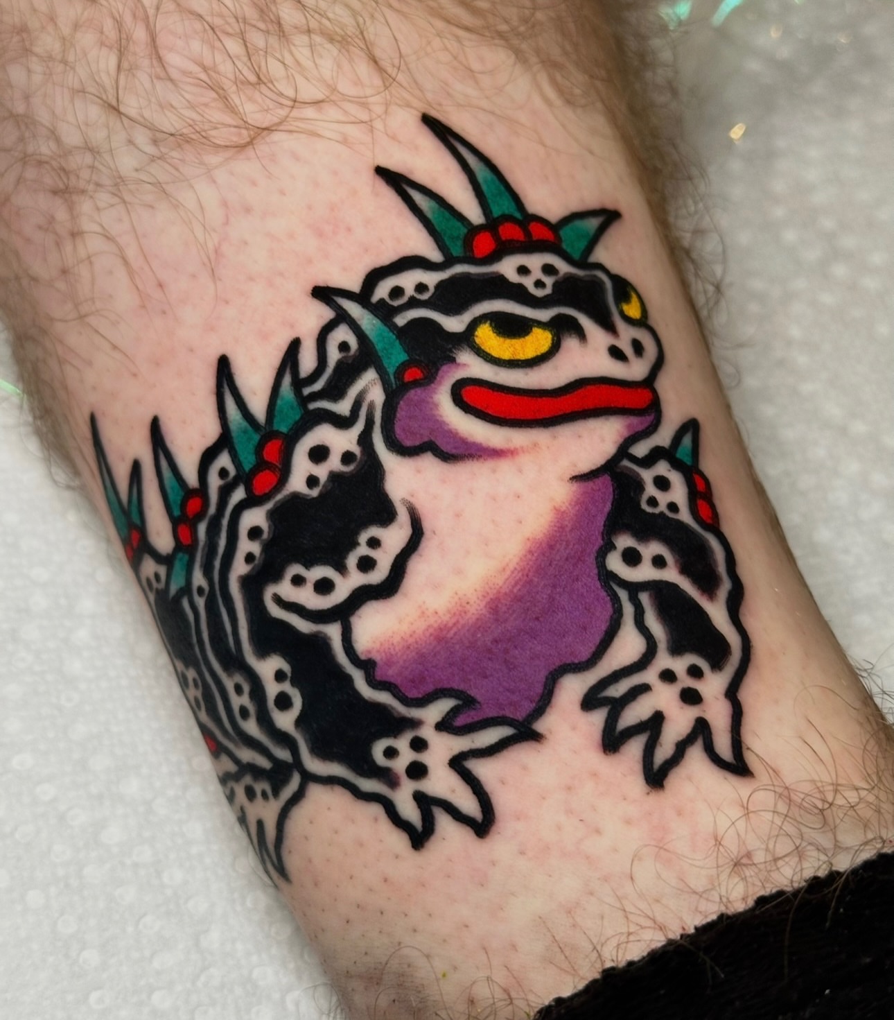 Frog American traditional tattoo on the forearm by Christian Rieben