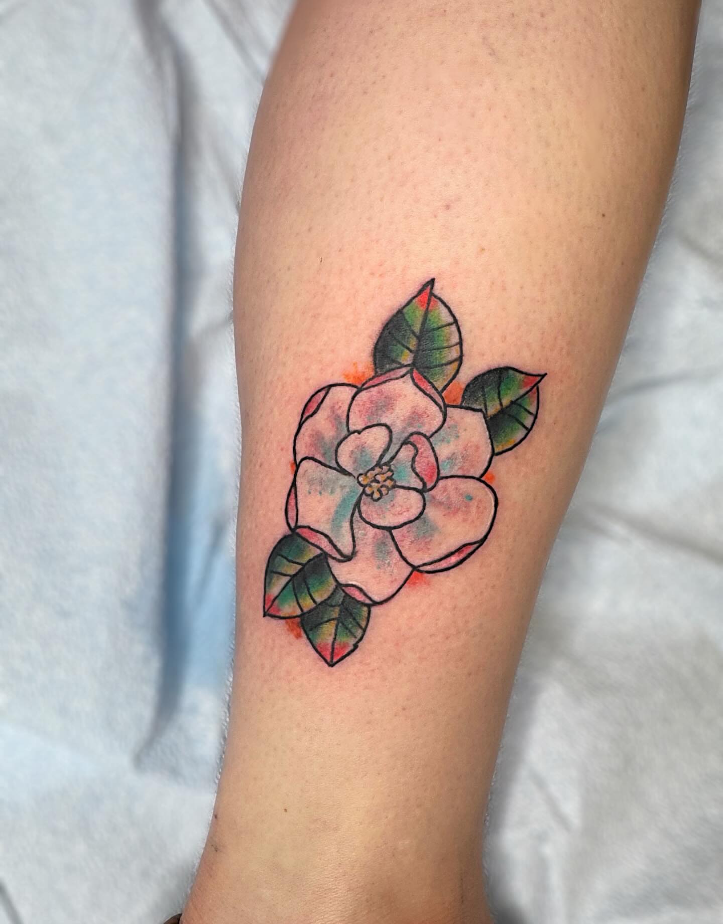 Flower watercolor tattoo on the forearm by @brocks_tatt_attic_, New Orleans, Louisiana