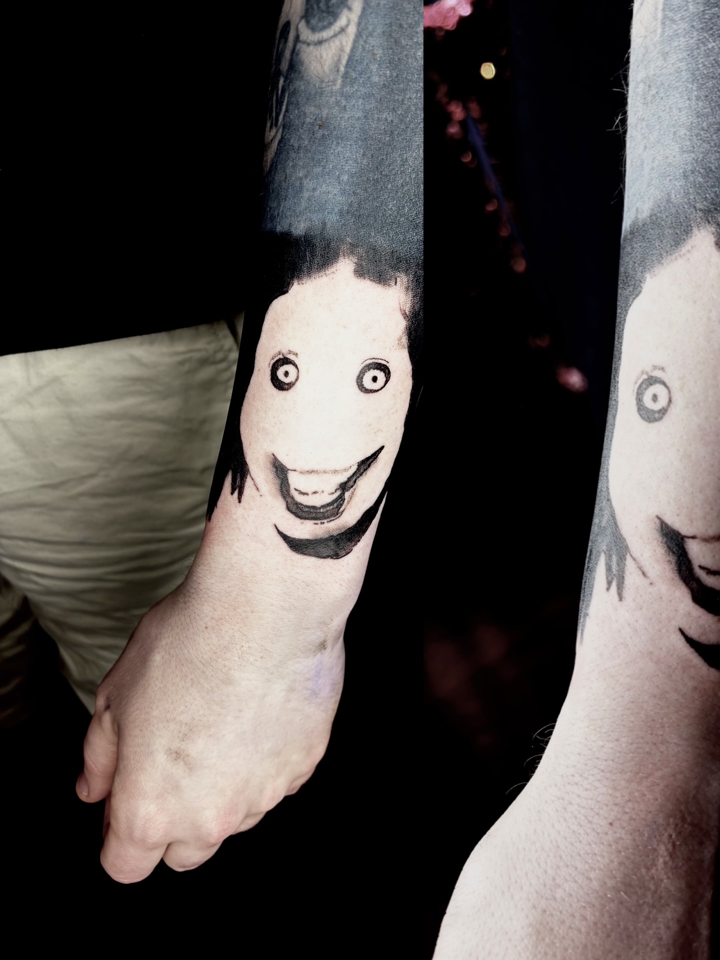 Smiling face black and grey tattoo on the forearm by Dev