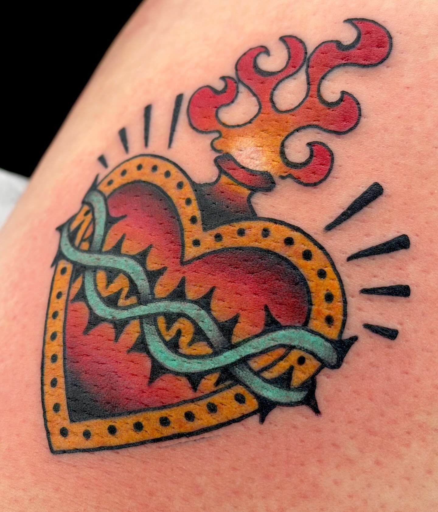 Flame and crown American traditional tattoo on the shoulder by Beeker, Bellingham, Washington