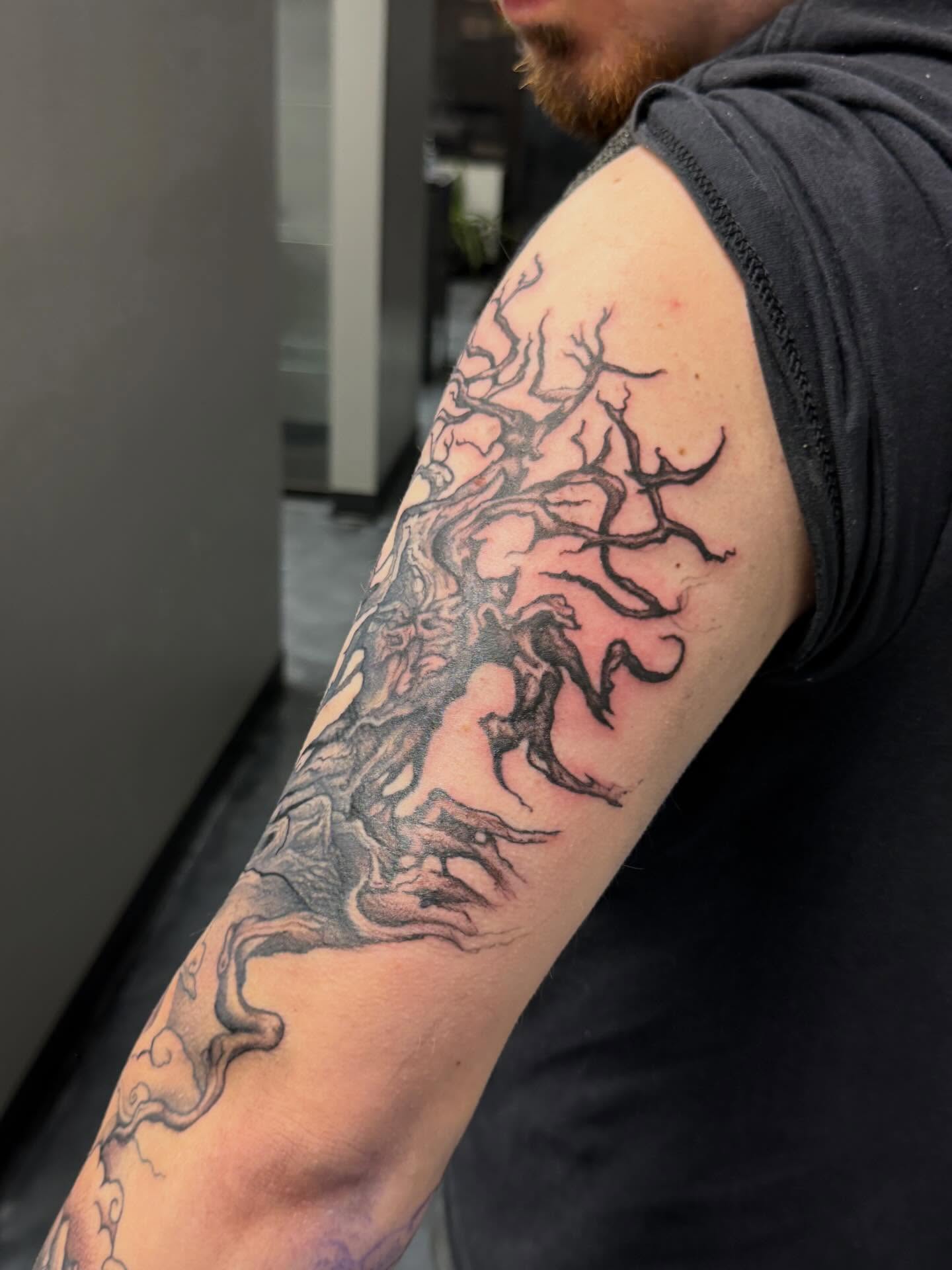 Tree and figure realism tattoo on the forearm by Katie Rojas