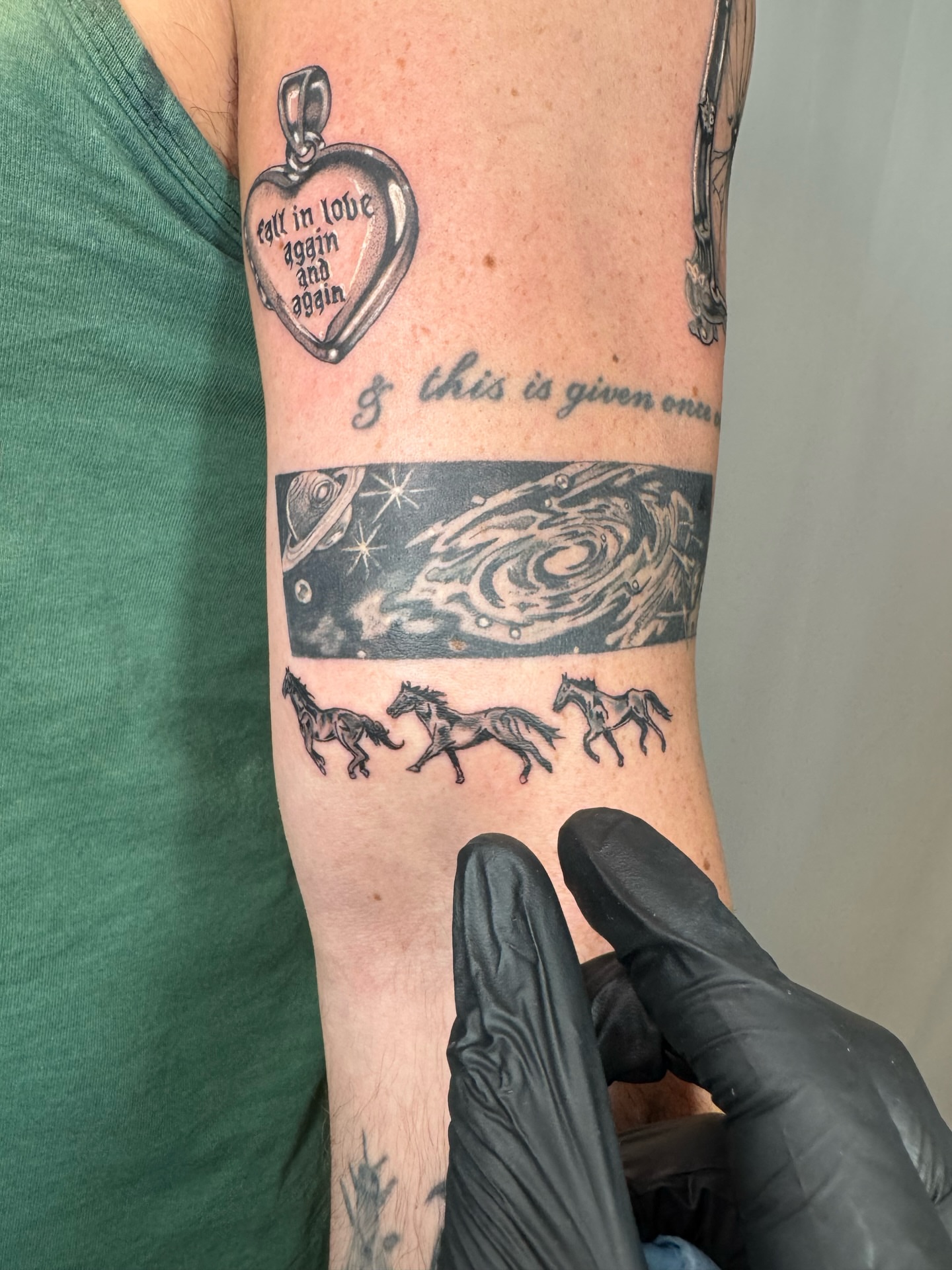 Galaxy and horses realism tattoo on the forearm by Franky A Bonifacio, Seattle, Washington